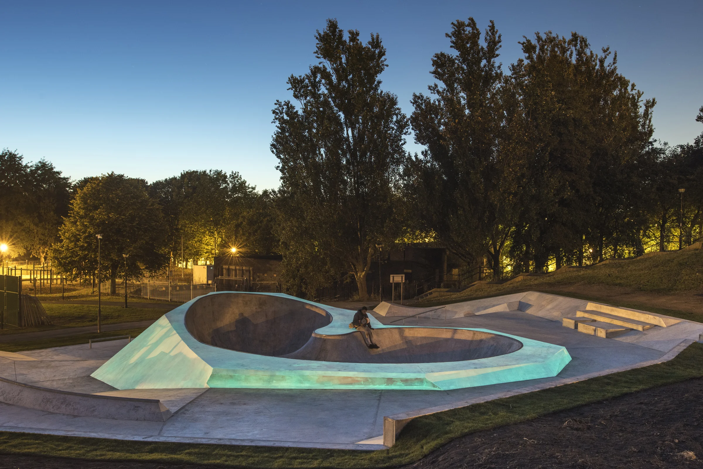 Koo Jeong A x Wheelscape, Evertro, 2015. Commissioned by Liverpool Biennial and Liverpool Mayor Joe Anderson Liverpool, UK 2015 Project Status: Completed Budget: Confidential We were approached by artist Koo Jeong A to assist in creating a three-dimensional concept design based on her ideas for a new glow-in-the-dark skatepark in Liverpool. The design responds to its immediate surroundings, as well as drawing on Koo Jeong A’s references to diamond shapes and forms conceived through the artist’s interpretation of the area. This permanent sculpture is a new public space for the city and a fully functional wheels park, open to skaters and BMX bikers to use and enjoy. Evertro is part of the Everton Park Action Sports HUB. ''The work is an interesting meeting of public art and the regeneration of a deprived area of the city, bringing together local skateboarders, the city council, neighbourhood community groups and Liverpool Biennale in this single pioneering project.'' (The Guardian) Photo credit: Thierry Bal