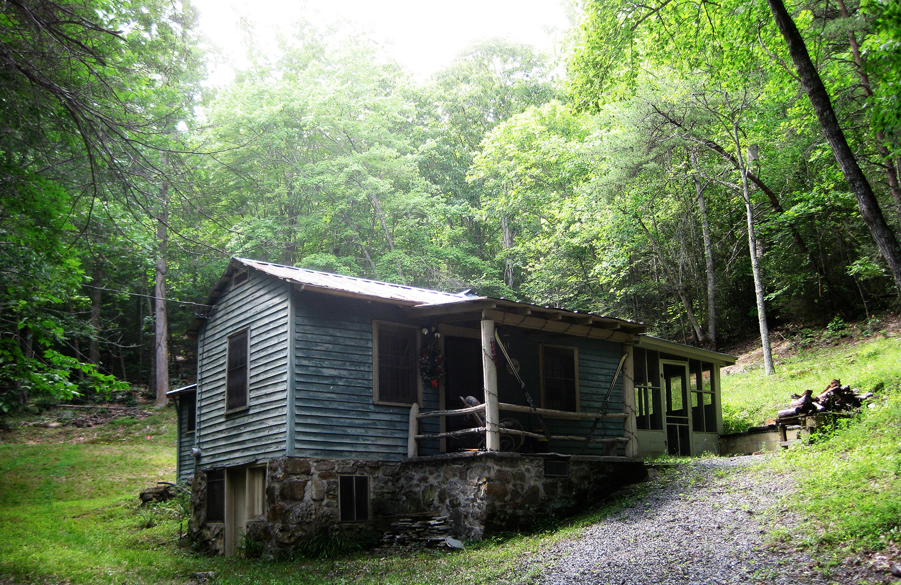 THIS WAS A NICE LITTLE CABIN THAT SERVED WELL FOR DECADES BUT WAS TIME TO BE REPLACED. WOOD WAS RECLAIMED FOR USE IN THE NEW HOUSE.