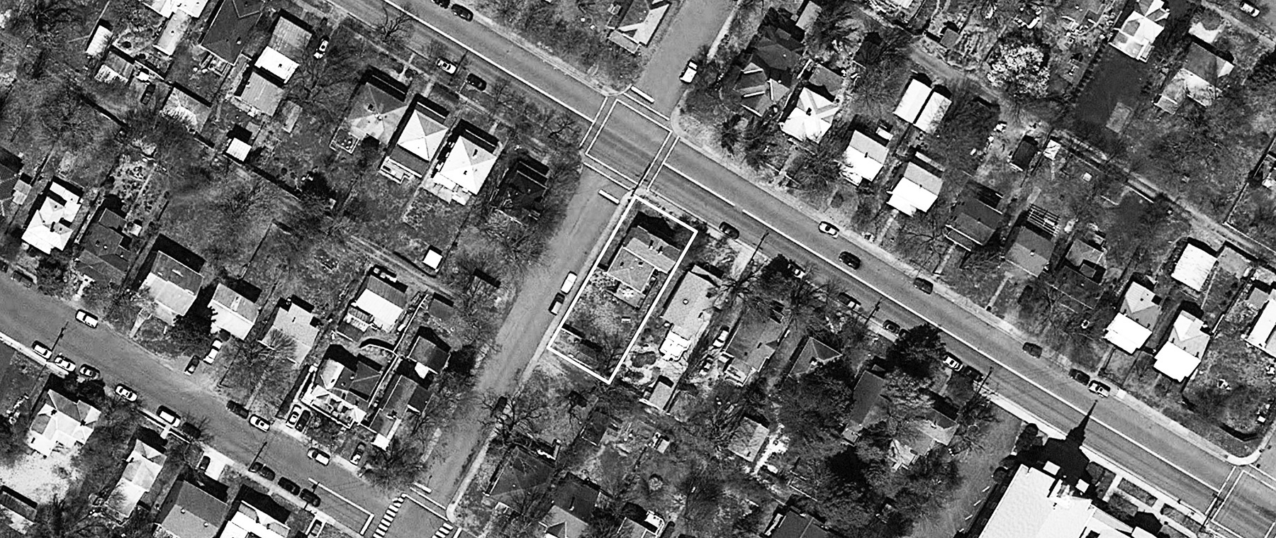 SITE AERIAL; LOT IS OUTLINED IN WHITE.