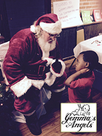 This little guy at Interfaith Shelter had a LOT to tell Santa!