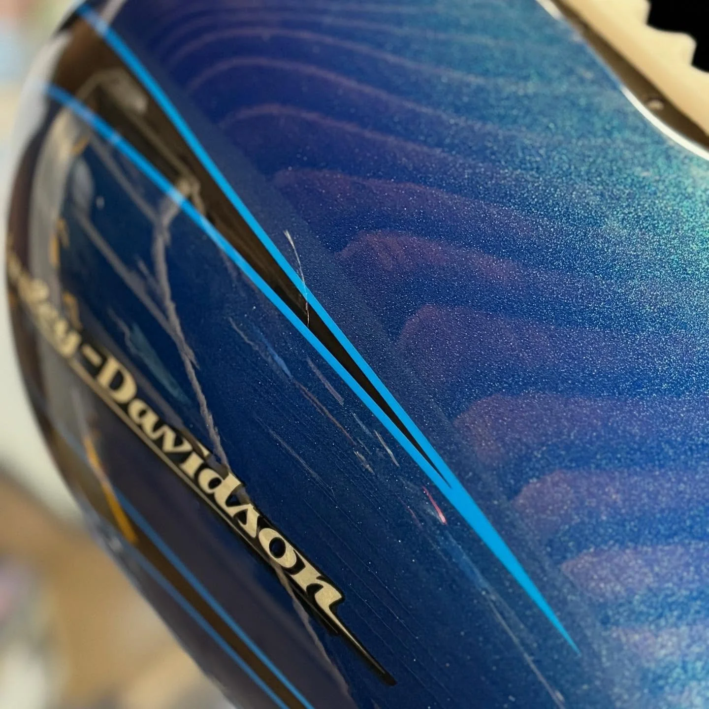 Blue Harley-Davidson tank — after paintless dent repair.