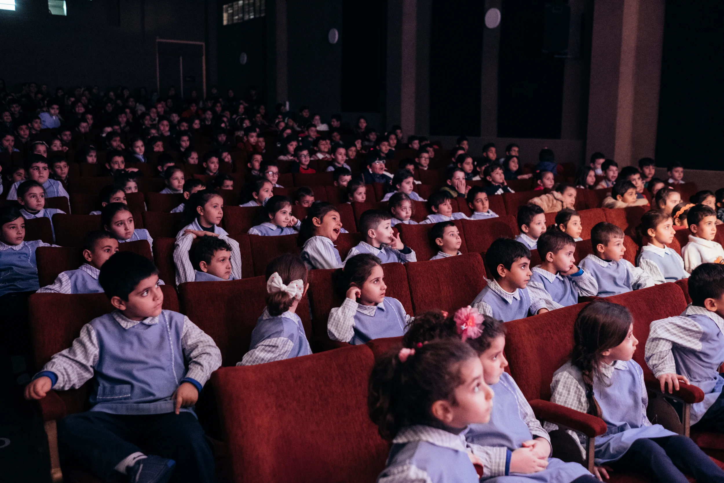 School kids in Beirut watching a theater play in Gemmayze.