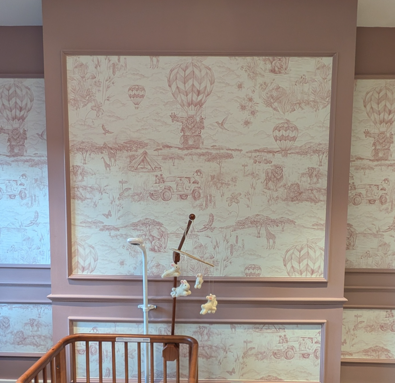 Framed animal toile wallpaper in New York City nursery