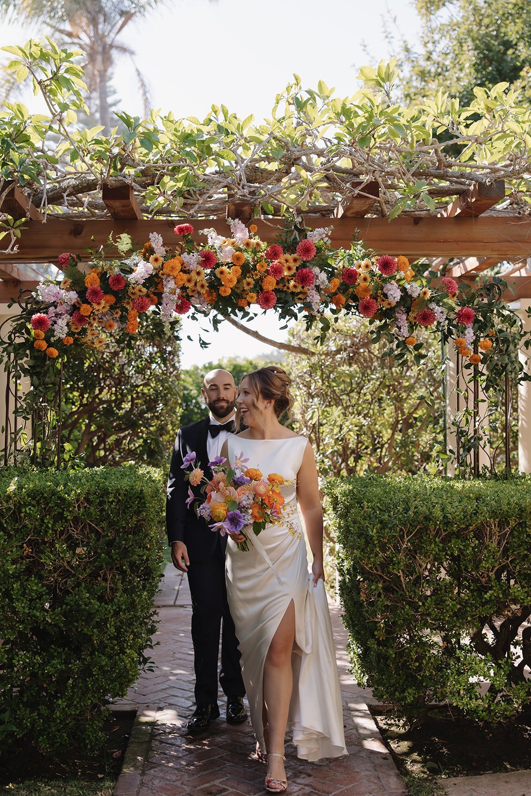 Bride and groom married at La Jolla Women's Club with lush florals