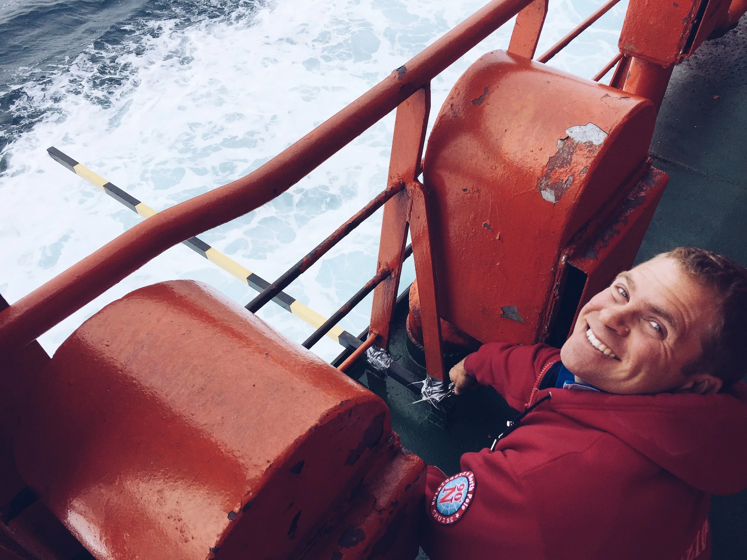 Working in the Barents Sea, affixing a ruler to the ship's side to help accurately estimate ice thickness as it breaks and overturns next to the ship