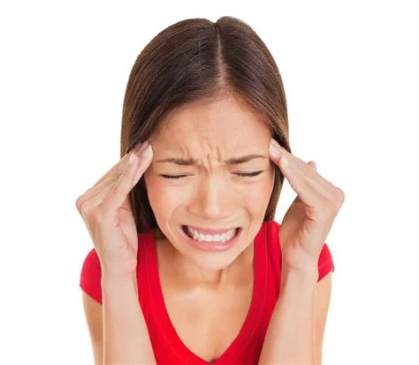 woman with headache .jpeg