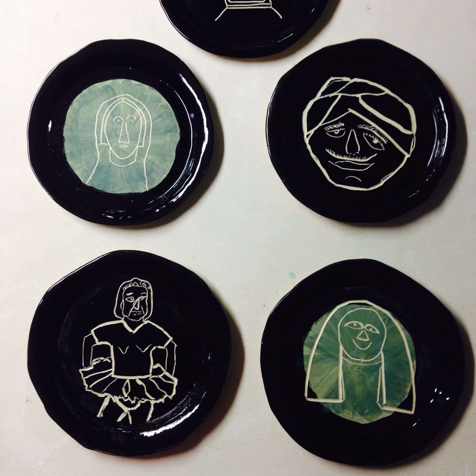A series of plates completed in a 6 week clay class.