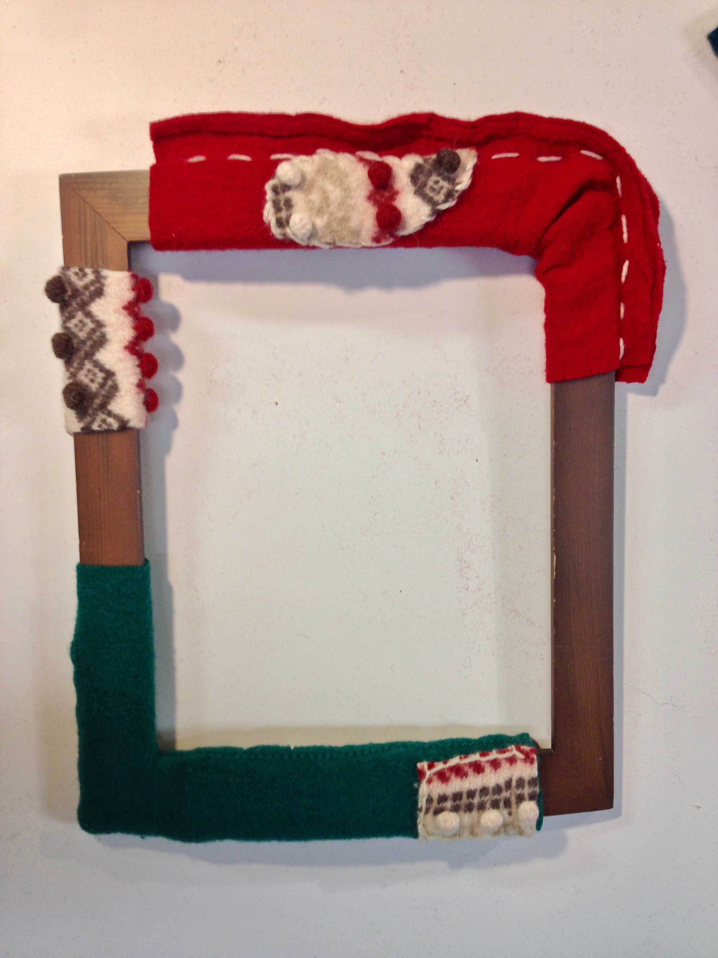 Creative picture frame with upcycled wool.