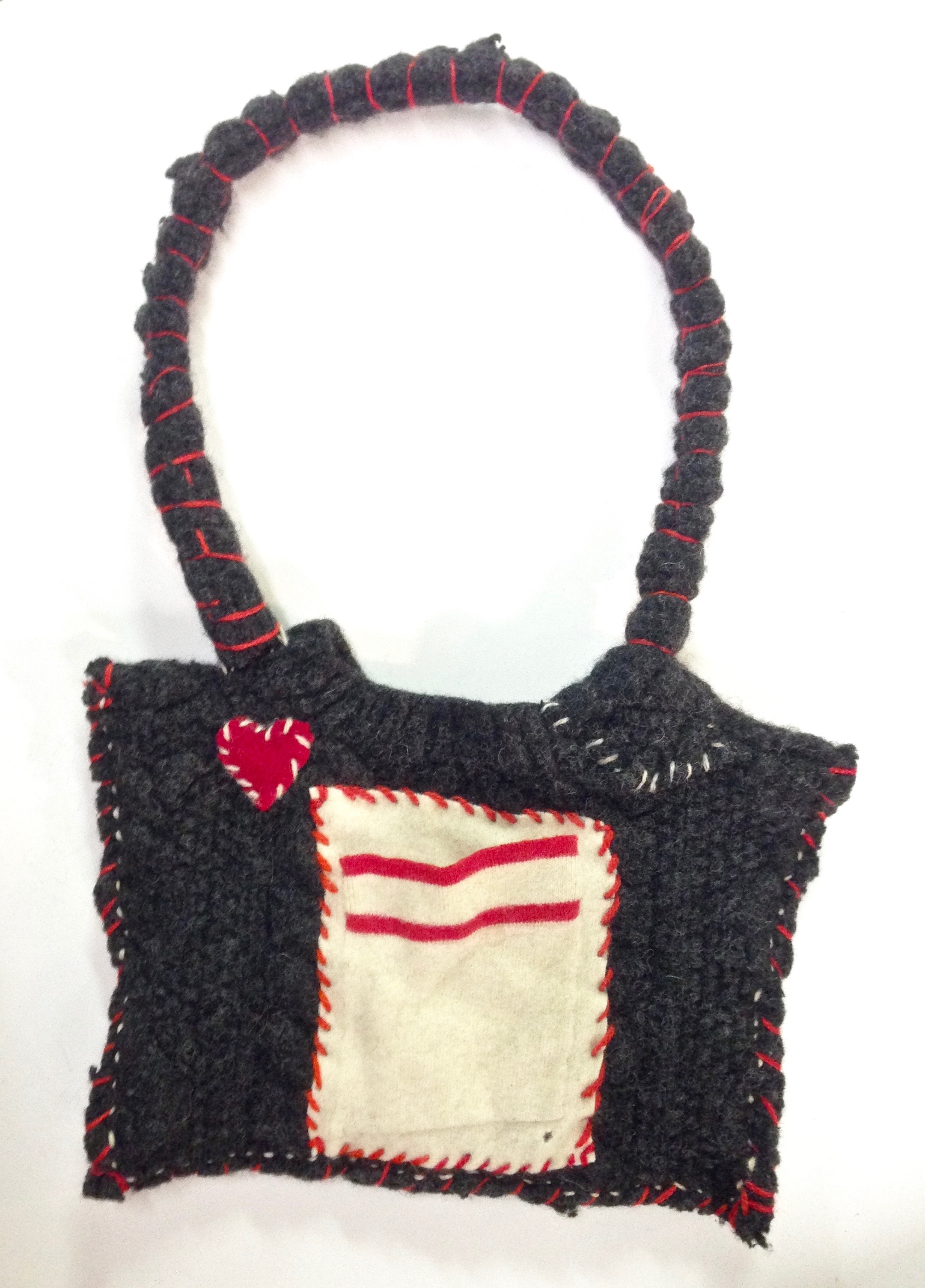 Small upcycled purse of felted wool.