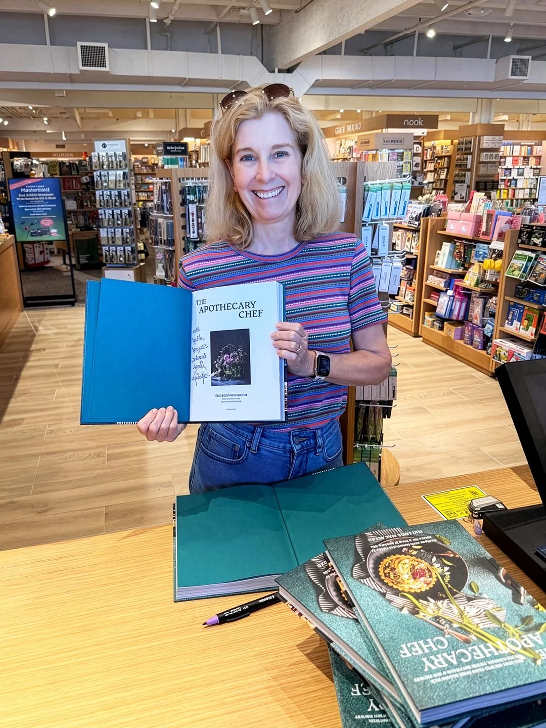 Signed with heart at Barnes & Noble Marina Pacifica, Long Beach — Natasha holds her new cookbook, “The Apothecary Chef,” now available on the shelves at this special LB location.