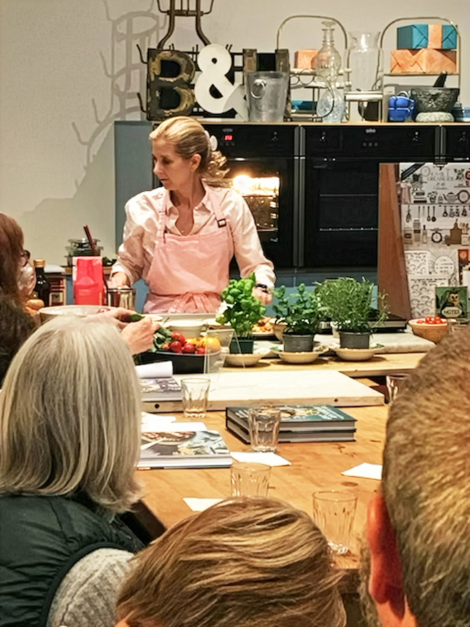 Natasha demonstrating one of her recipes from THE APOTHECARY CHEF at the CookBookBake event in Hove on March 5, 2026.