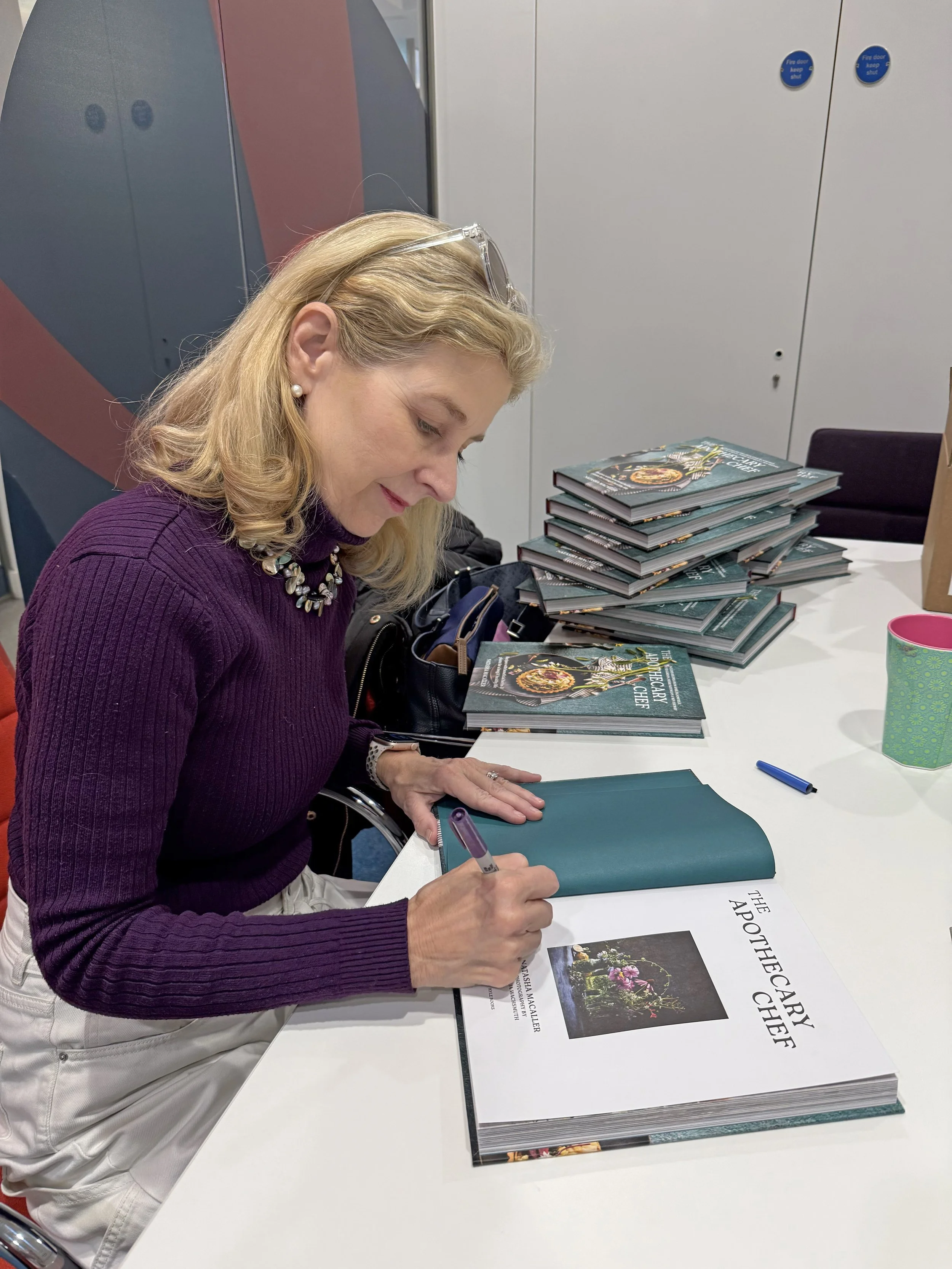 Natasha signing copies of her new cookbook THE APOTHECARY CHEF at the launch celebration at Divertimenti, London, on March 4, 2026.