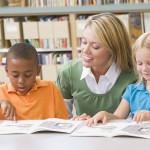 bigstockphoto_Two_Students_In_Class_Reading__3917495
