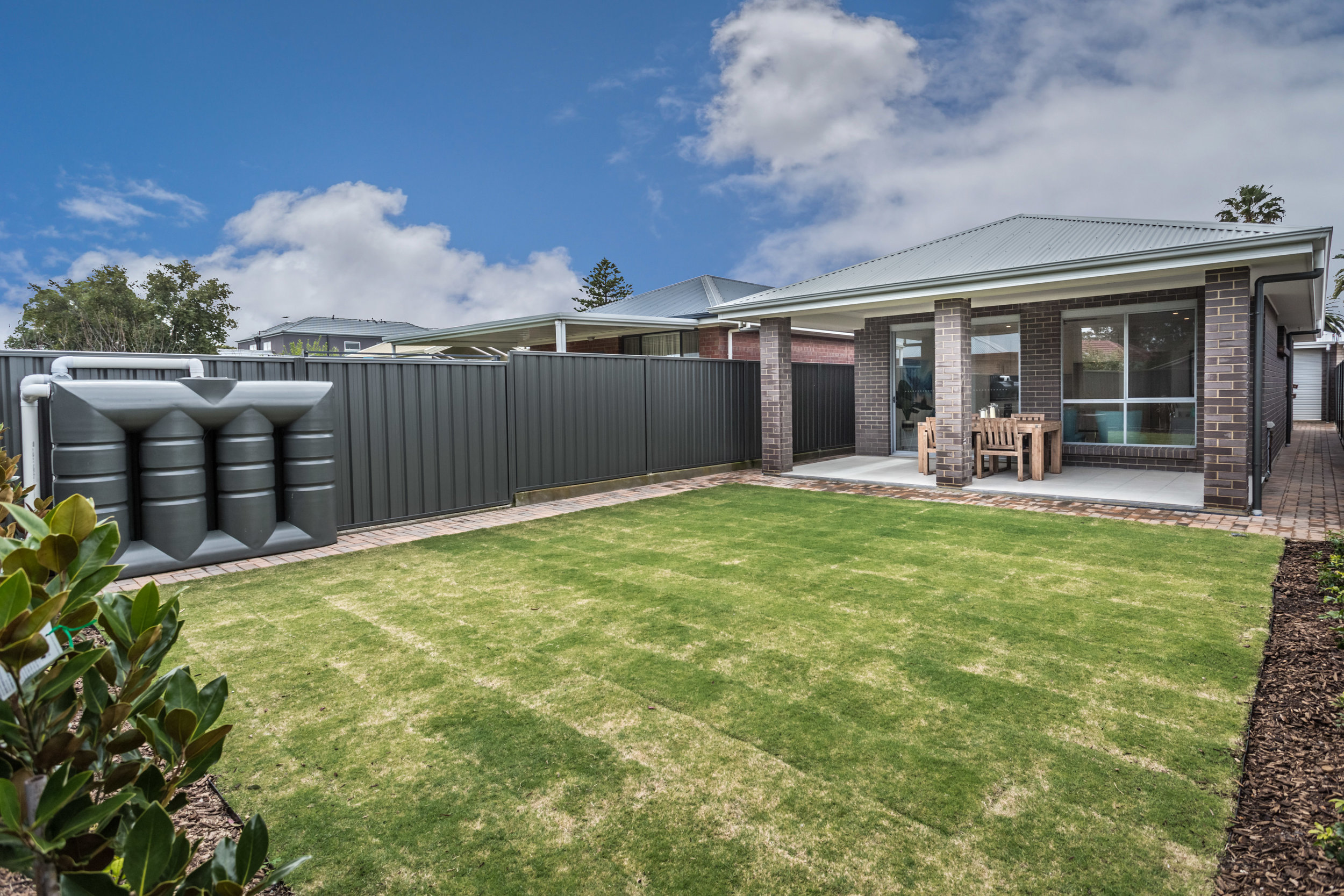 Lovely low maintenance back yard with all weather Alfresco