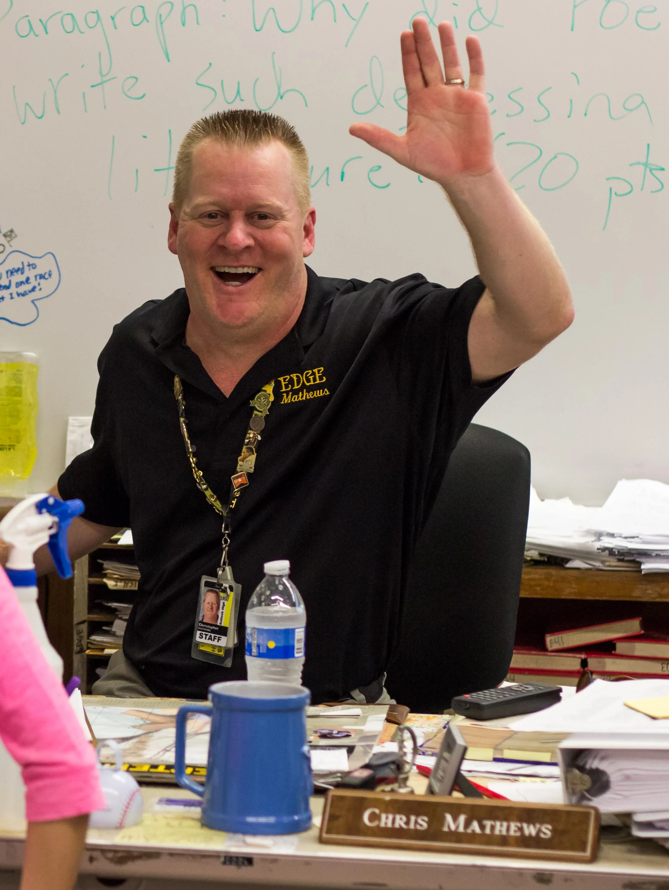 Mr. Mathews waves for the camera during Antioch High's 2014-2015 Back To School Night. 