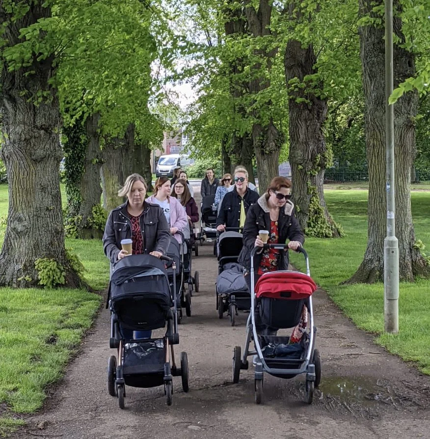 A group of mums walking with prams