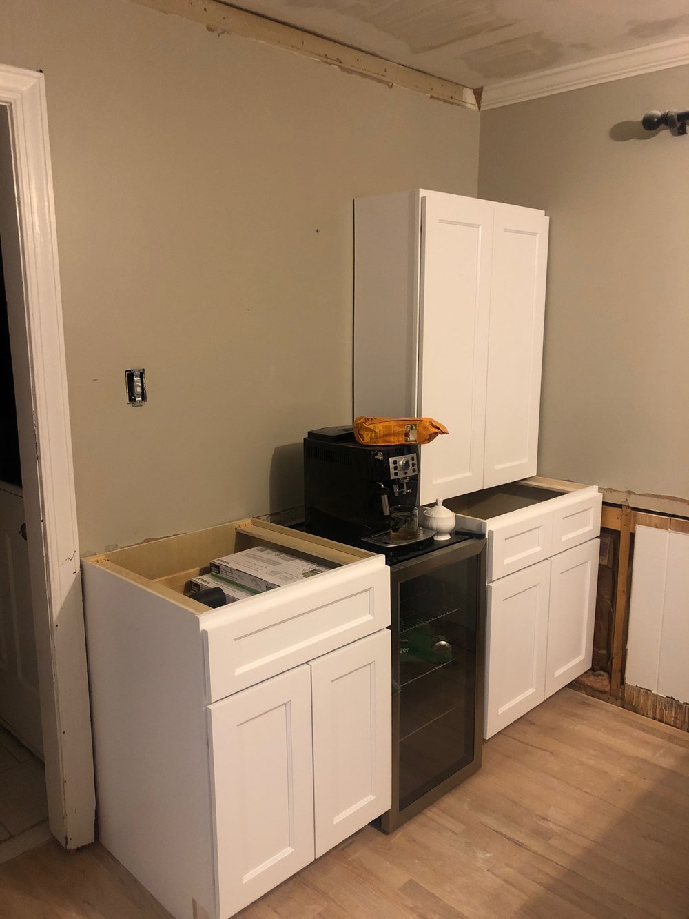 Who doesn’t want more cabinet space?! We had a blank wall in the eat-in kitchen area, so we decided to make it the wet bar. Obviously, we didn’t wait to plug the coffee maker back in!