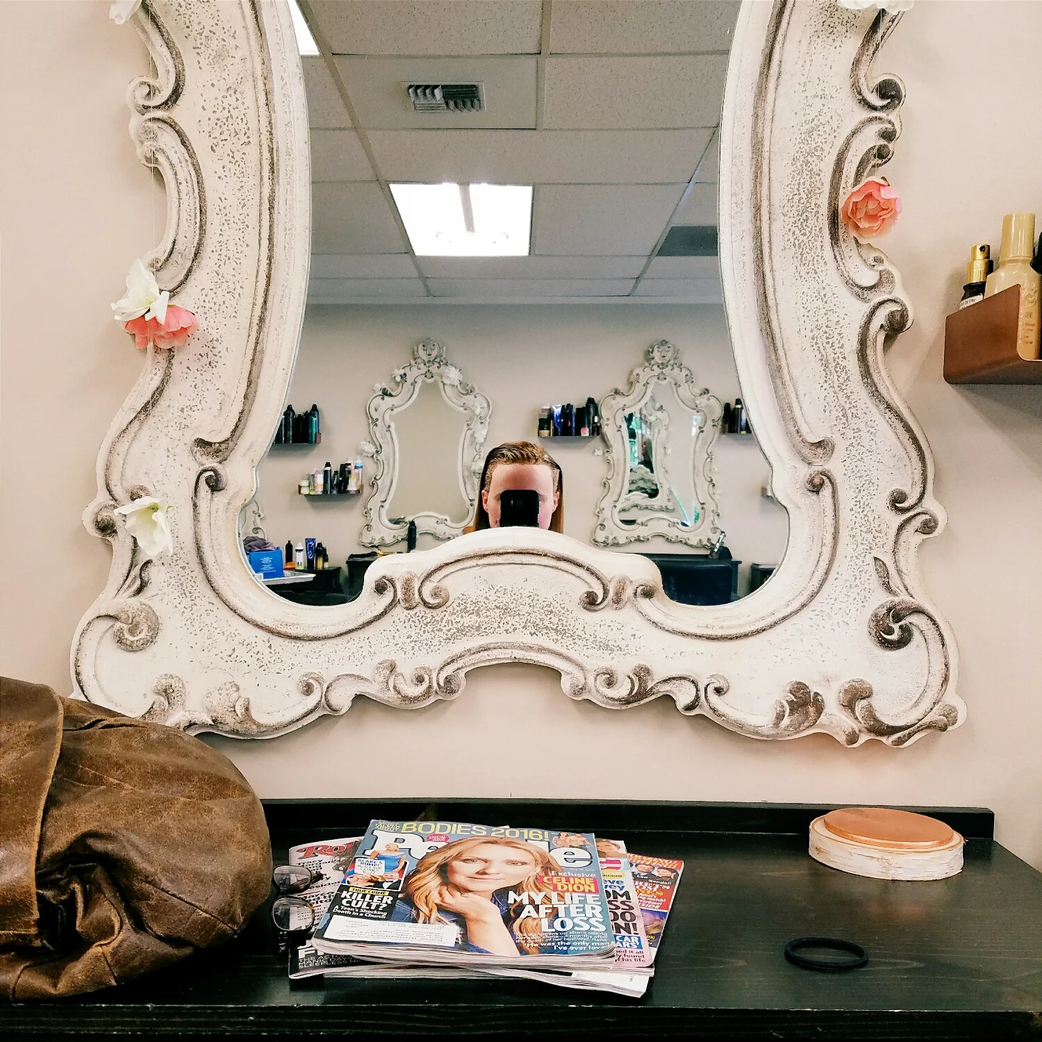 I love the mirrors at my hair salon, but I can hardly see myself over the frame!