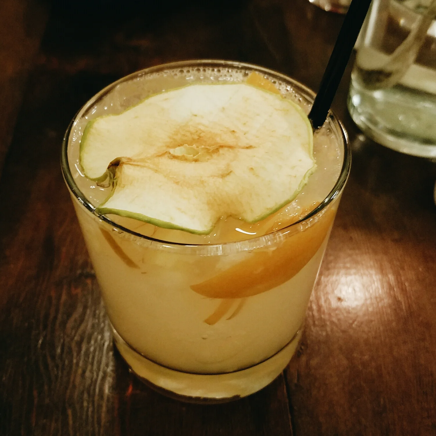 Winter cocktail garnished with an apple chip