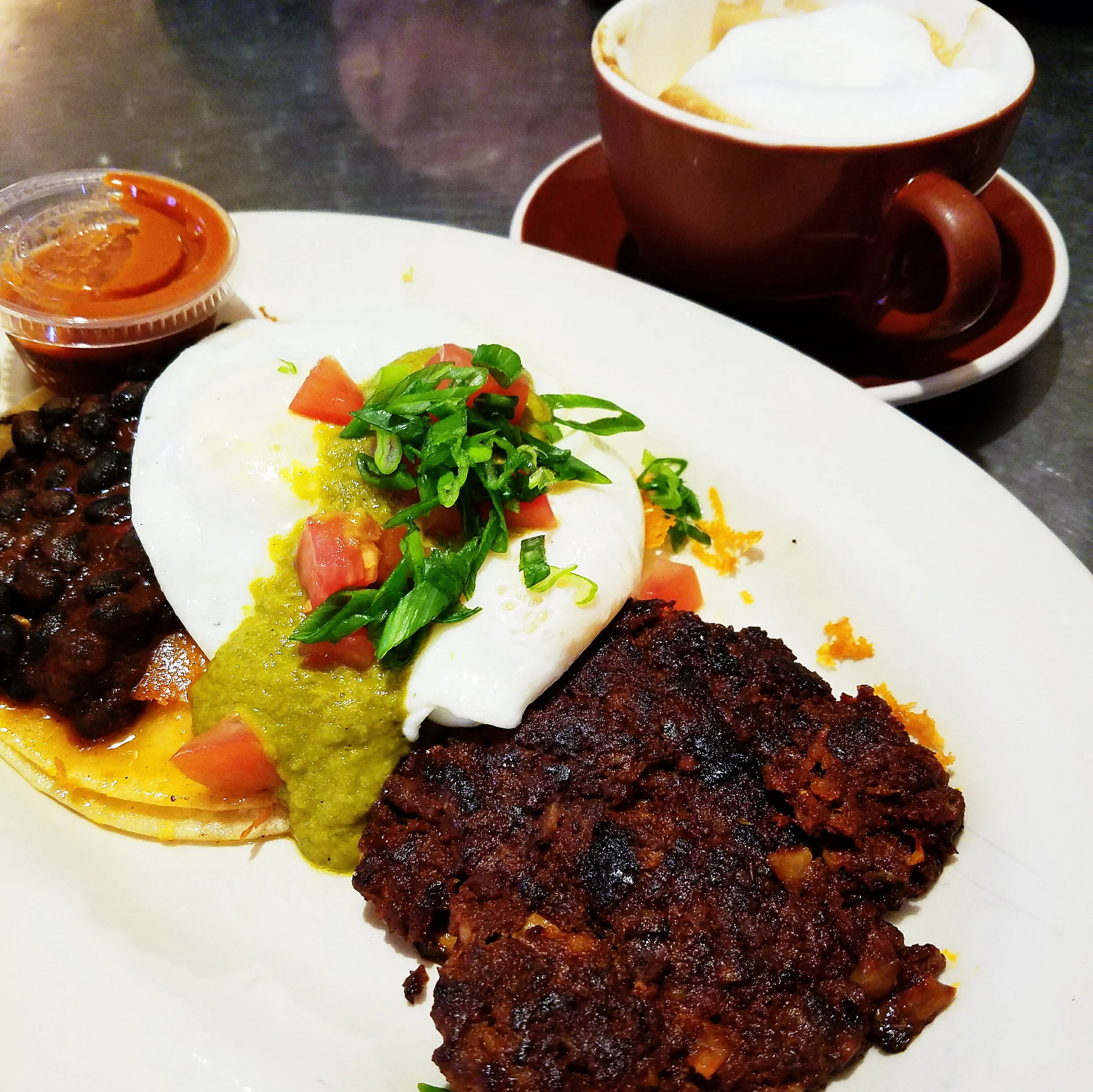 Huevos Rancheros with a generous side of chorizo