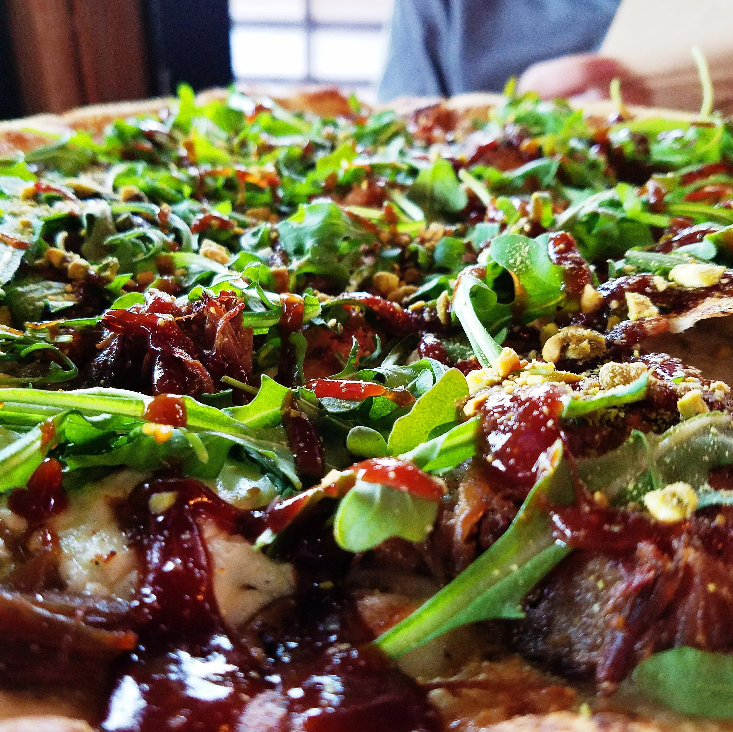 Possibly my favorite pizza of all time. Roast duck, arugula, pistachios, and goat cheese