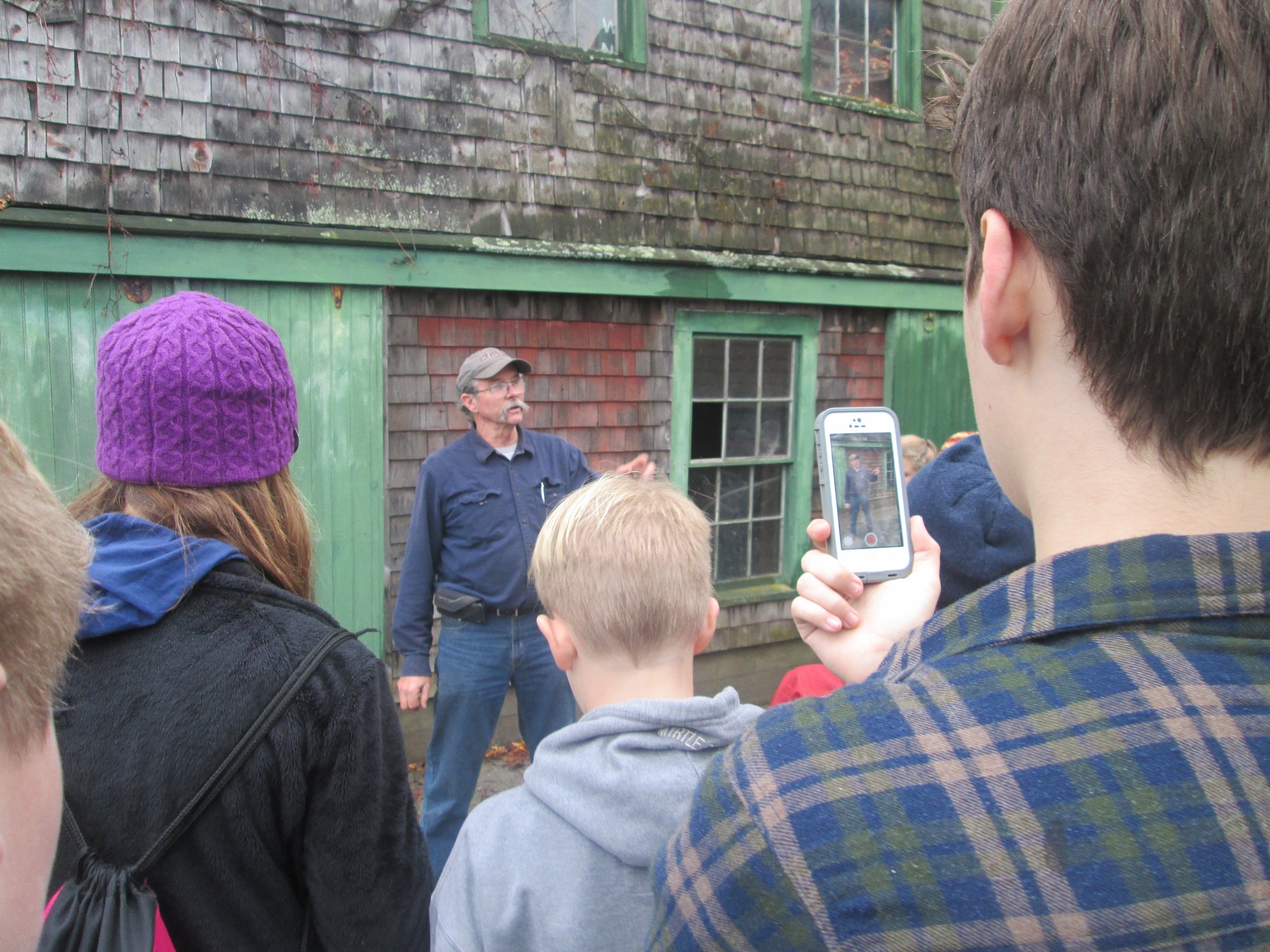 Hope seventh grade students conduct interviews at a local mill. Photo by Andrea L. Curtis