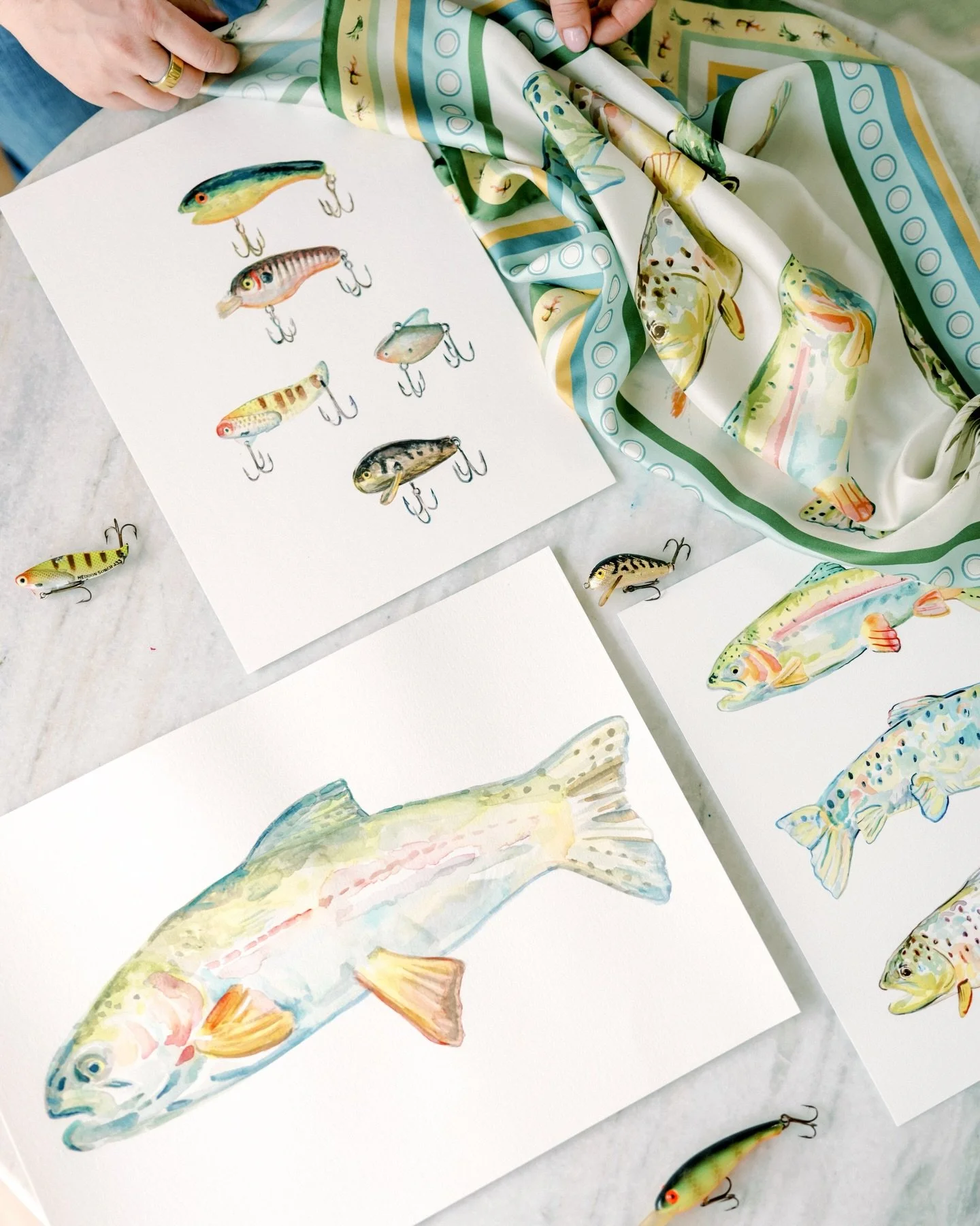 🎣 Something new is launching this upcoming Wednesday. Any guesses?! 🤩🙌

#silkscarfstyle #flyfishing_flygirls #watercolorfish #silkscarfdesign #surfacepatterndesigns