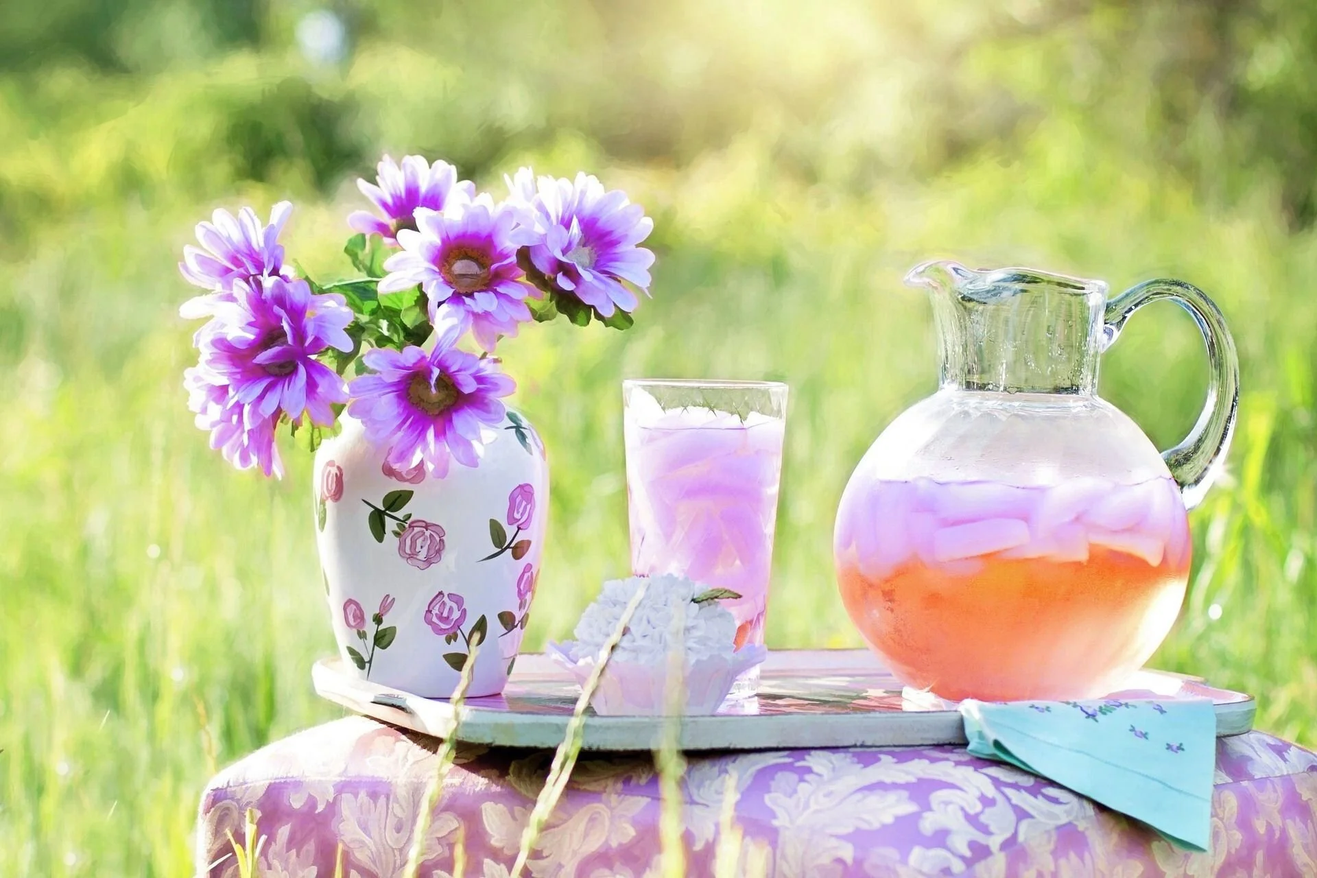 lemonade and flowers with a cupcake in the garden