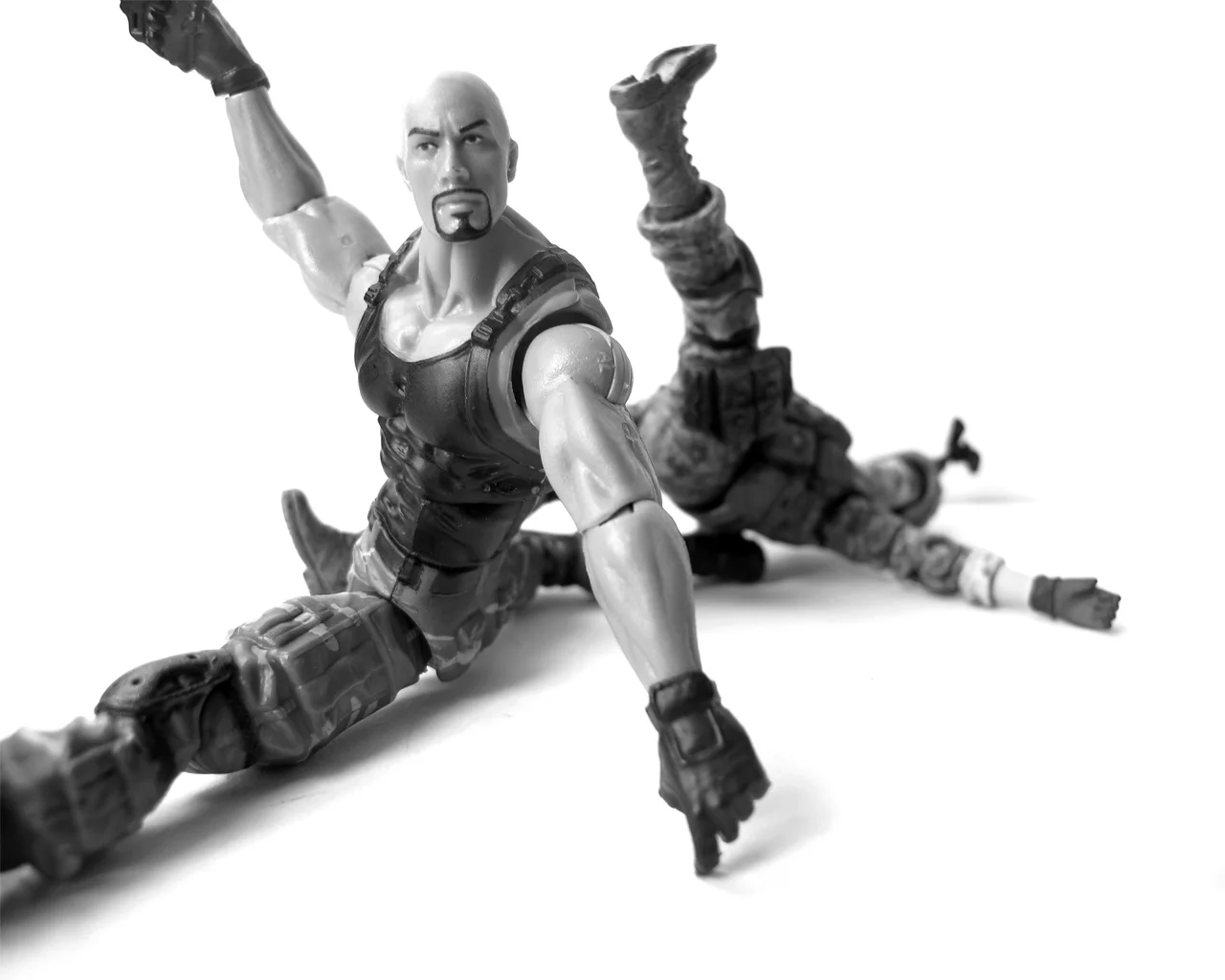2012 still life photography The hypermasculinity of action figures re-imagined with a subtle intimacy and reframing of the hero posture.