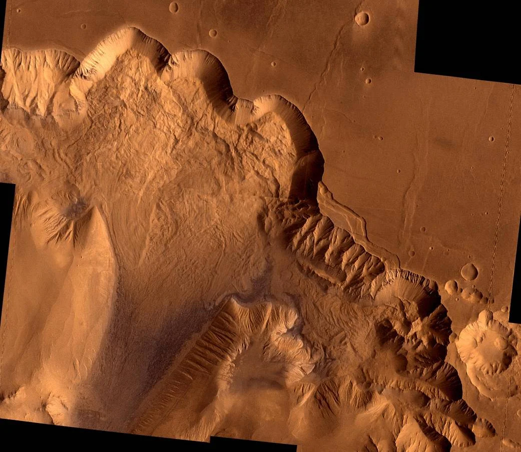 Dr. Jessica Watkins talks about enormous landslides on Mars that are millions of years old. This image is of Ophir Chasma, on the surface of Mars. Image Credit: NASA/JPL/USGS