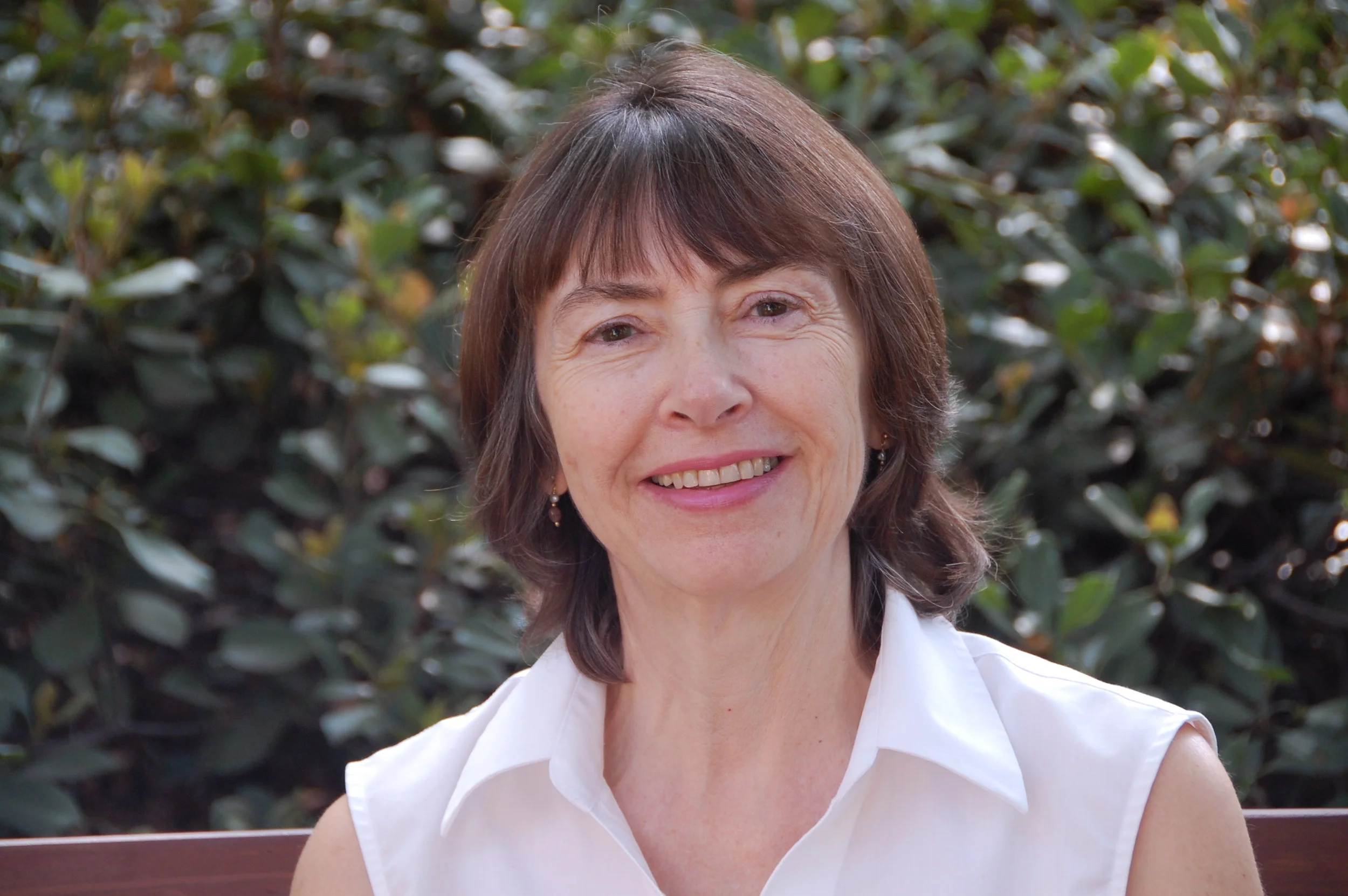 Dr. Norna Robertson shares a drink from her home country and talks about a specific part of LIGO . She explains that LIGO’s eighty-pound mirrors are suspended by four, incredibly thin, silica fibers that were developed just for this project.