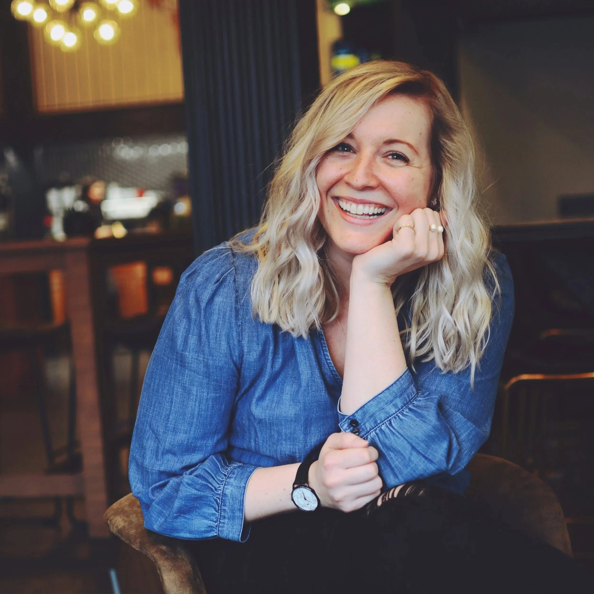 A woman smiling at the camera.