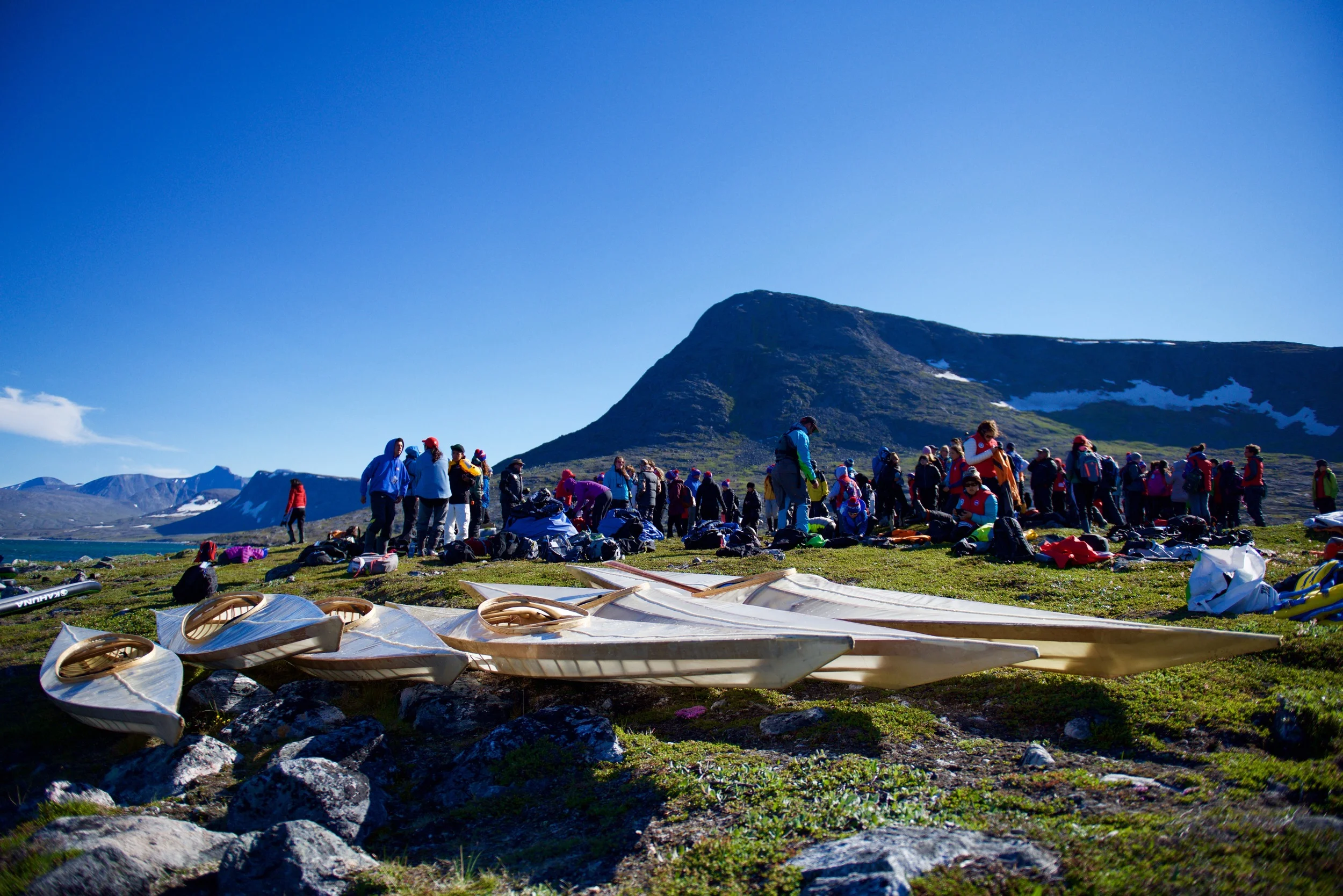 Inuit and qalunaat youth get ready to explore Eclipse Channel in handmade Inuit qajaqs. I think this might be the first time in 150 years that Inuit have paddled handmade Inuit qajaqs in the northern reaches of the Torngat Mountains. #ᖅᔭᖅ #qajaq #qisforqajaq #makinghistory Students on Ice