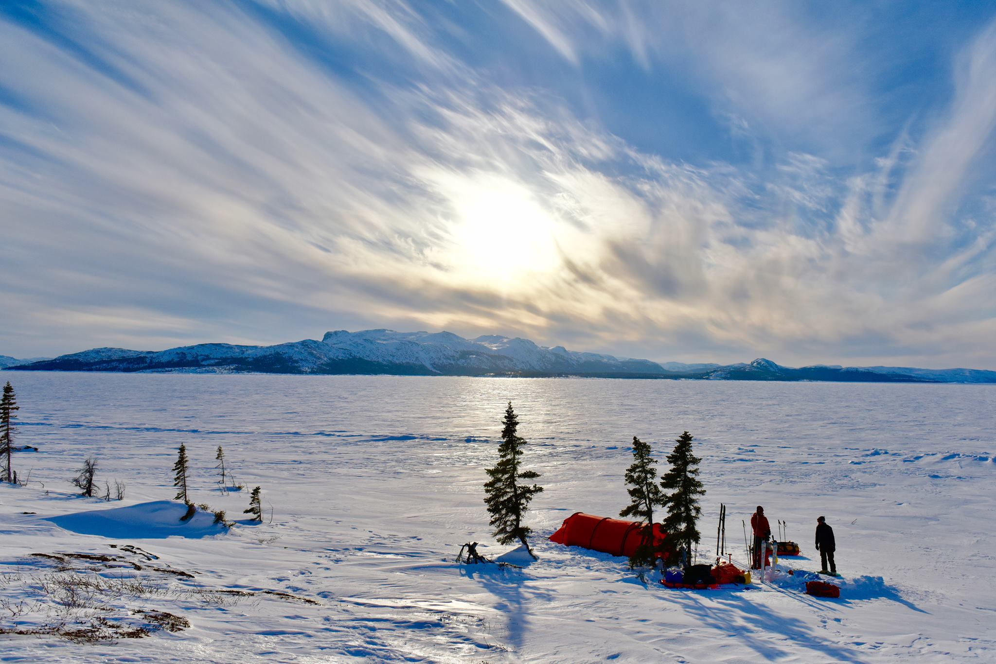 Setting camp on the ice after skiing nearly 200km around South Aulatsivik Island and climbing to the summit of Mount Thoresby, with it's 1000m vertical drop overlooking the Kiglapait Mountains, and the polar bear dens on the Island's northern tip. 