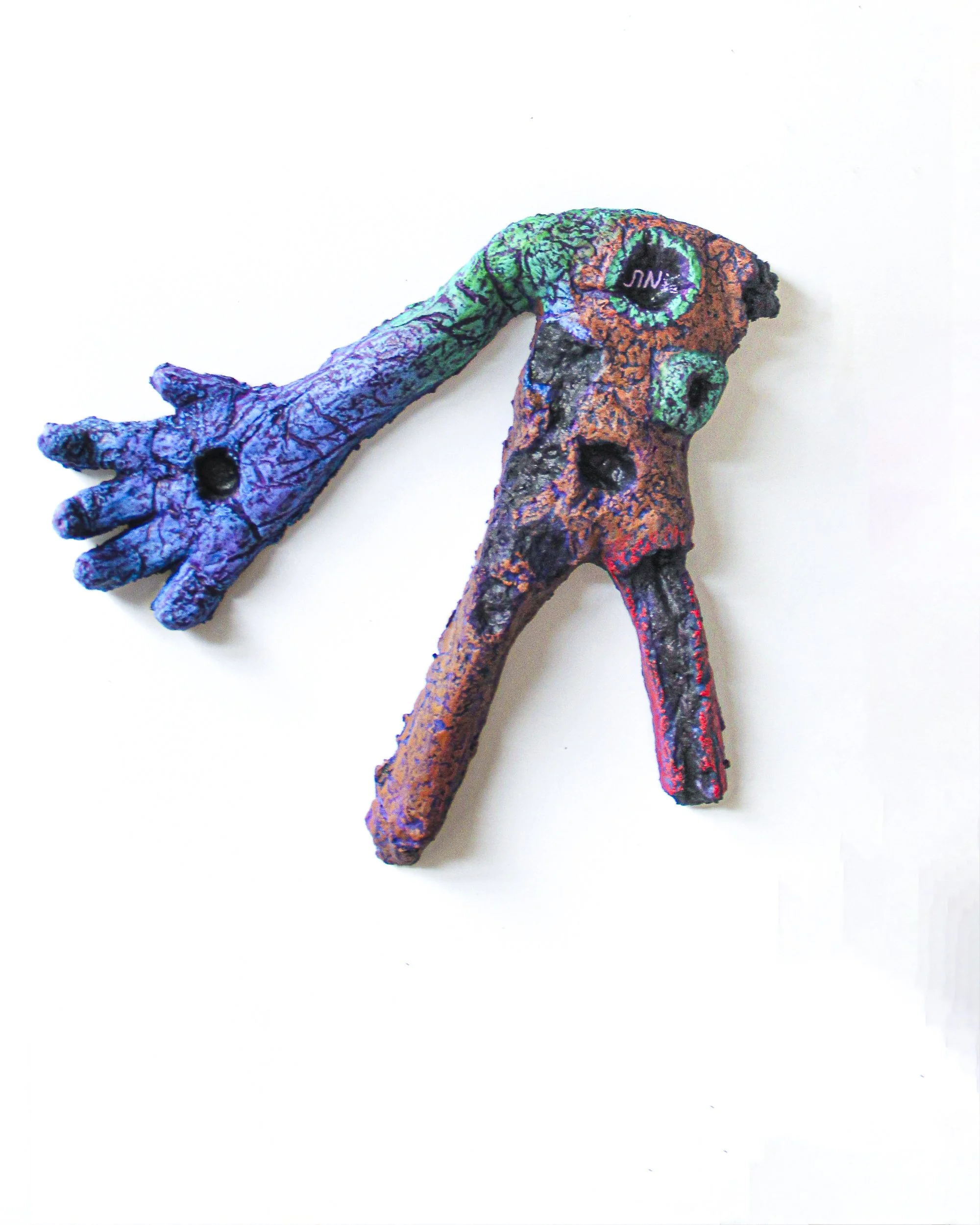 Exhausted Golem ד (Self Portrait), 2025. Paper, clay, watercolour, and wax pastel. 17 × 23 × 5 cm. Shown with Exhausted Golem ג (Self Portrait), 2025.