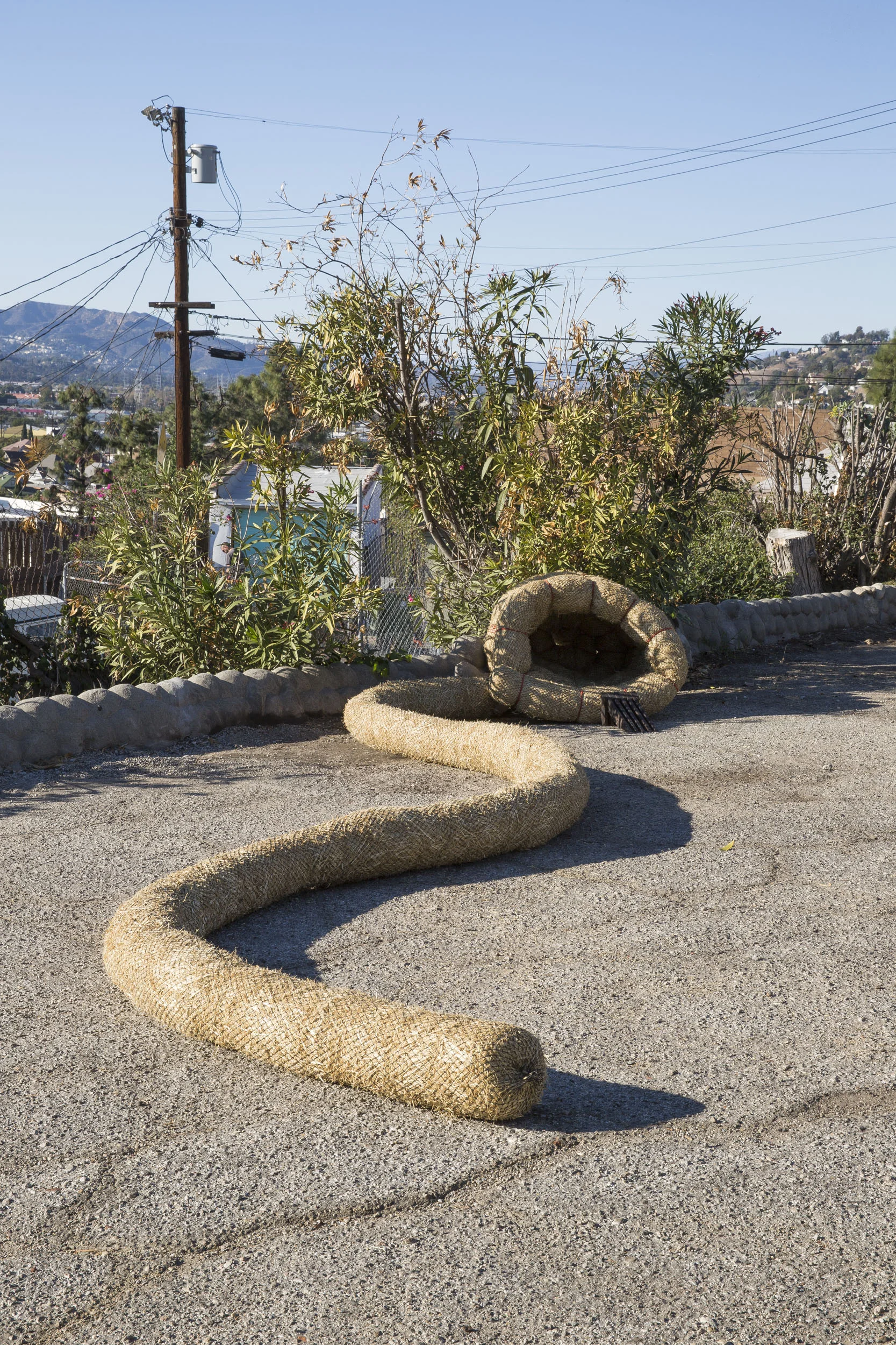 Hole #13. John Zane Zappas, Time Snake II, 2015. Straw wattle & rope. Dimensions variable.