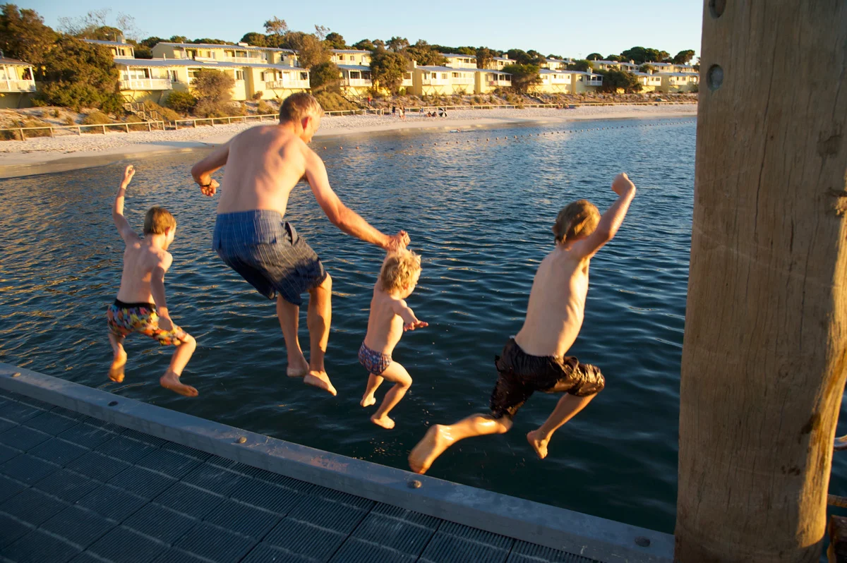 family-jumping-off-the-jetty.jpg