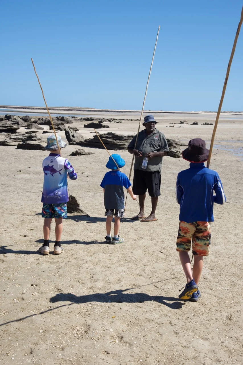 Spear making with kids at beach