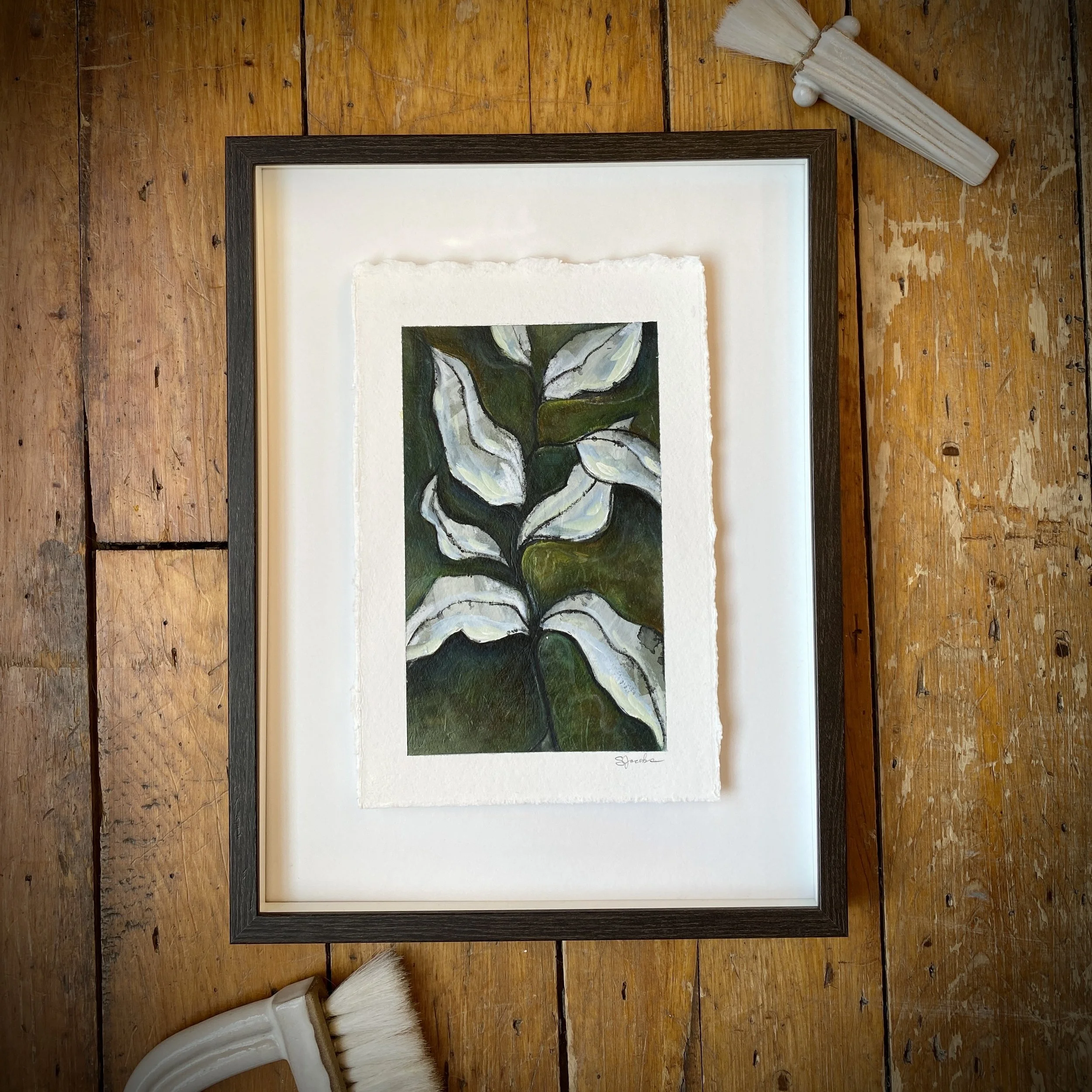 GreenLeavesOnPaper_FOnFloor_ShelleyJacobsNov2021.JPG