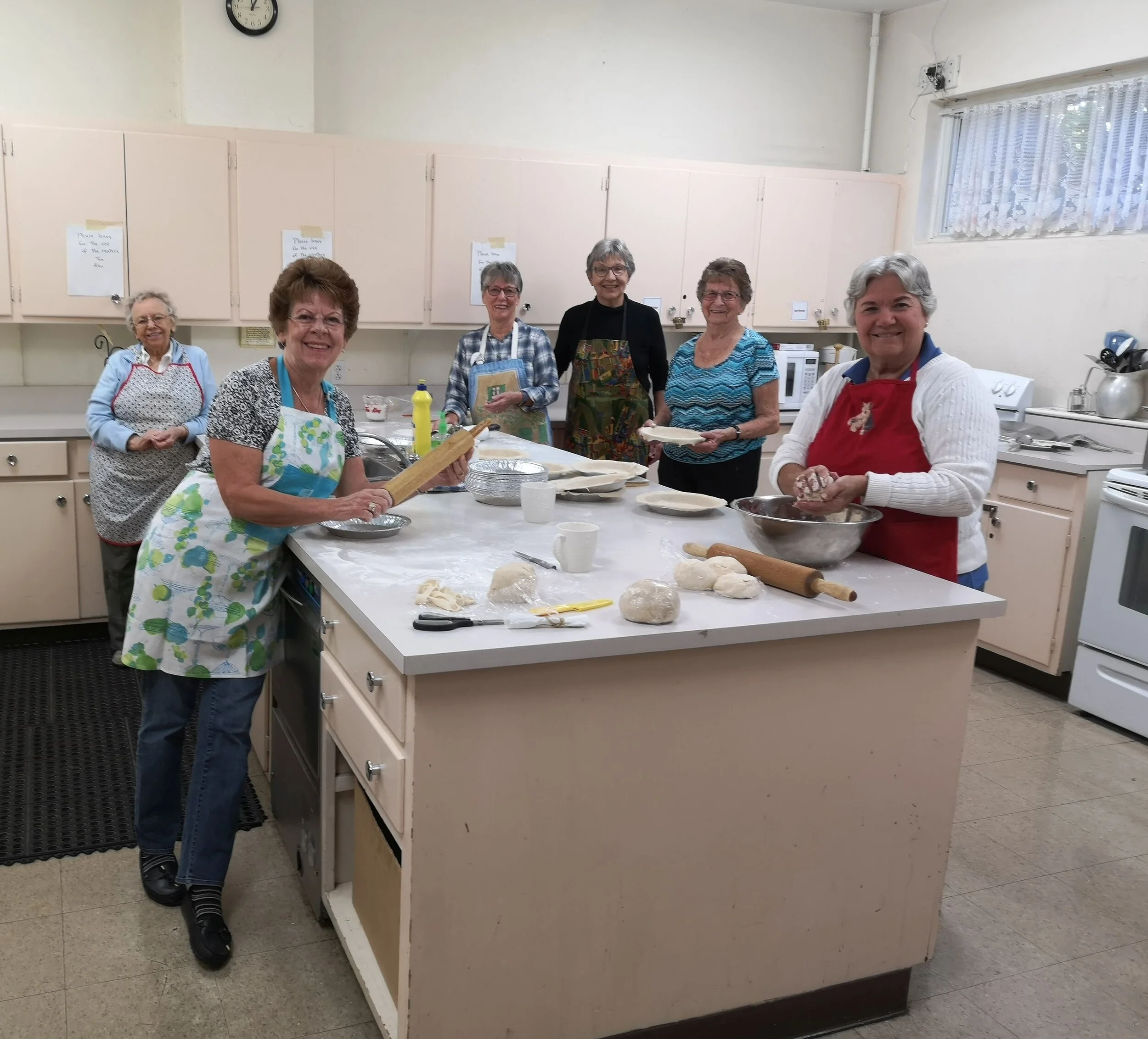  “THE HOLY ROLLERS” hard at work preparing delicious meat pies for the christmas bazaar. hope to see you there! PHOTO - D tOMSONS 