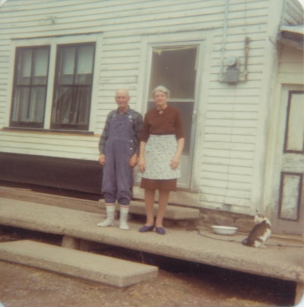 My Great Uncle Archie and Grammy on the porch of the old homestead, watched by a ubiquitous cat. Rural New Brunswick Gothic at its best.