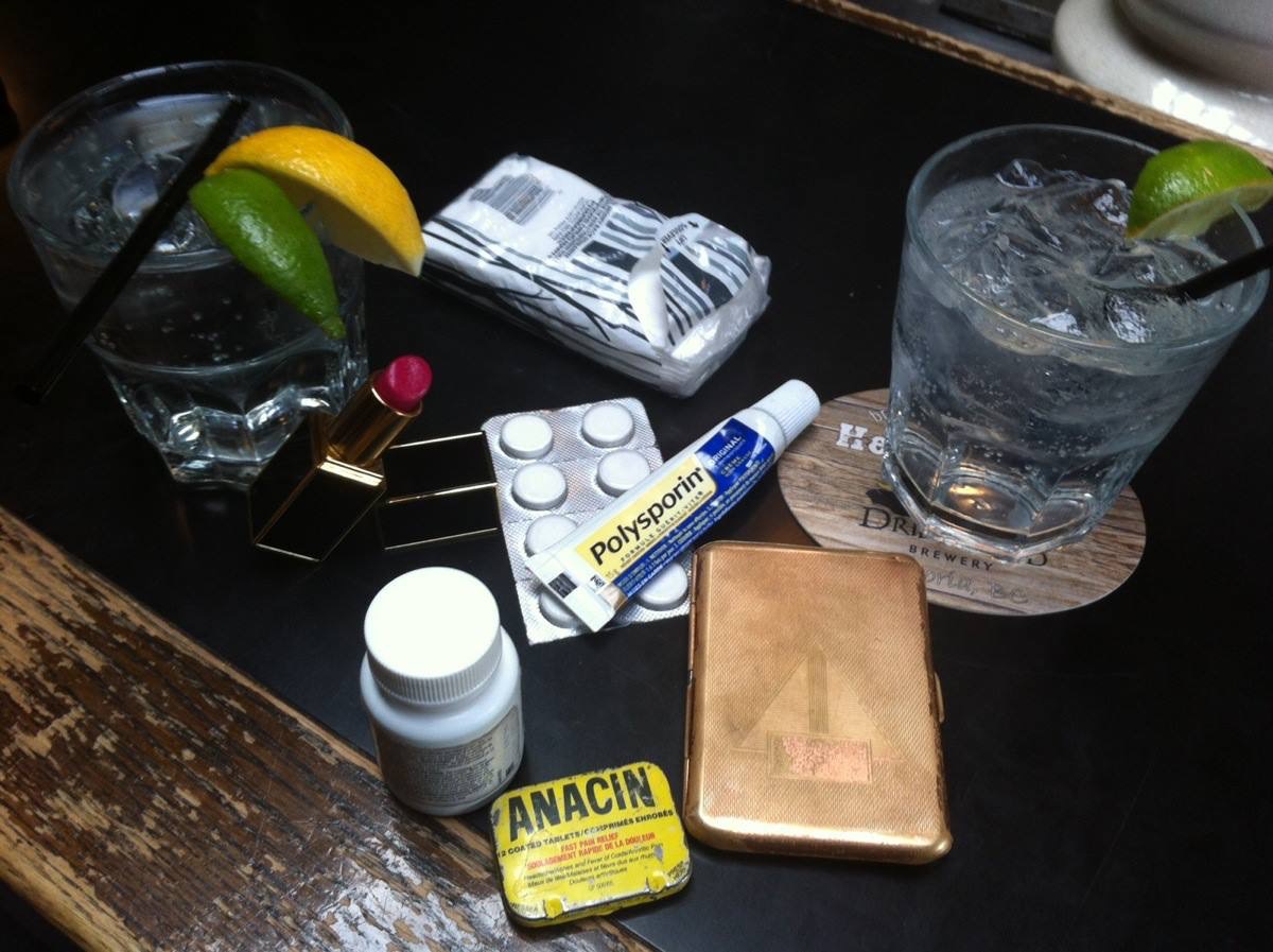 Probably funnier in our own heads, but one day at Barney's we decided to empty pockets and purse onto the bar and make a photo diary entry. Titled "Tears, Regrets and Recriminations" this brought to life a couple of the characters we invented. Brent was my physician Dr. Penis Morningwood, and I was his doddery, frail and vain Dowager patient in constant need of attention and medication in the form of "tinctures", which were administered to me whenever I would become hysterical. Thus, the old Anacin tin which Brent always carried, next to my Advil and other "medcin's", including booze. Well, we thought it was hilarious...