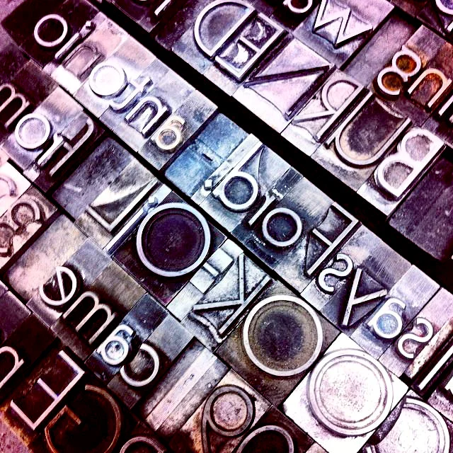 work-in-progress shot, of hand-setting metal type (click to expand image)
