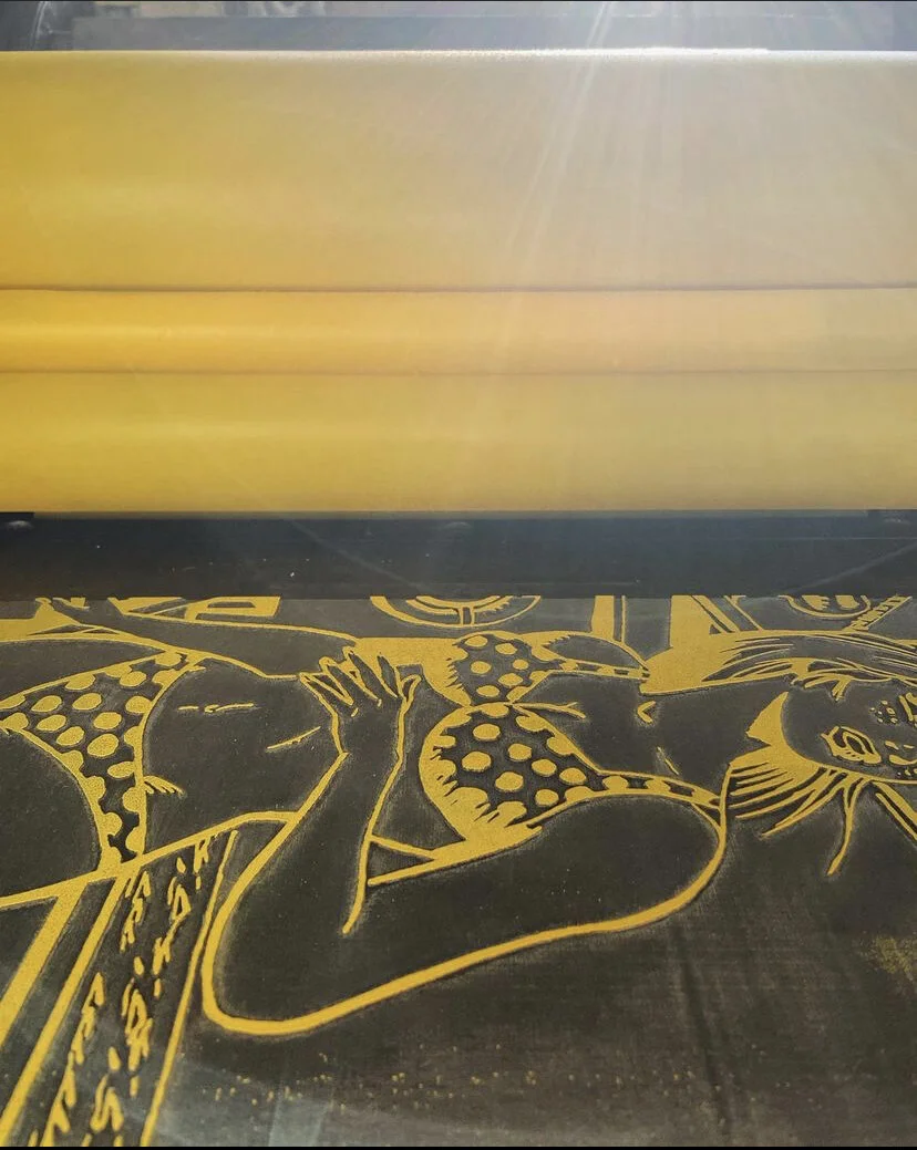 on the press, first layer: lasercut lino plate, neon yellow ink, & west texas sunset, May 2021