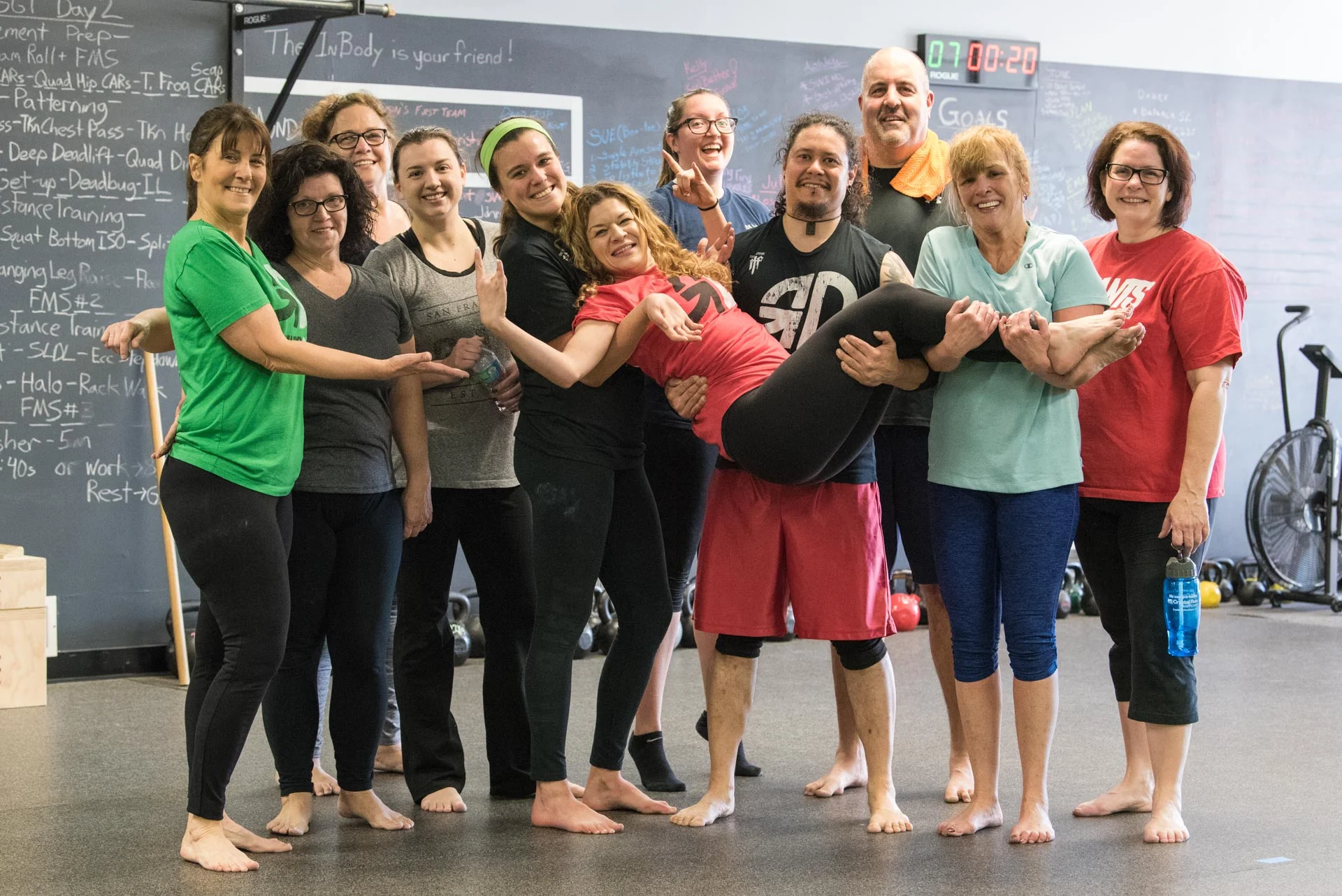saturday team holding up andrea 3x2-2.jpg
