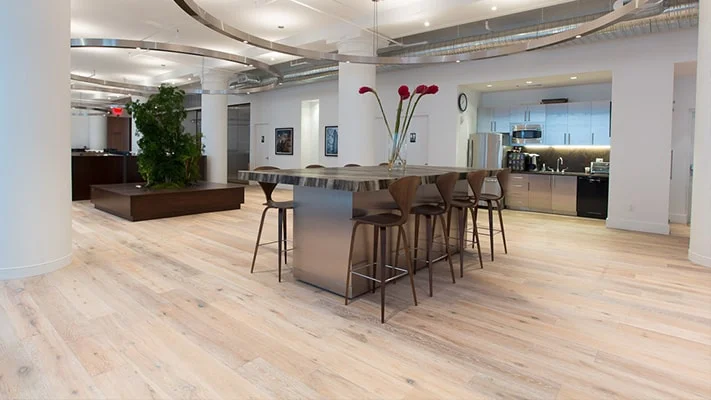 Always timeless, Artisanal Hardwoods is a curated selection of white oak and walnut in light to dark shades that make iconic hardwood planks look fresh yet maintain a rustic richness. This luxuriously crafted engineered hardwood collection with micro bevel edges is in stock and sustainable for any impactful design.