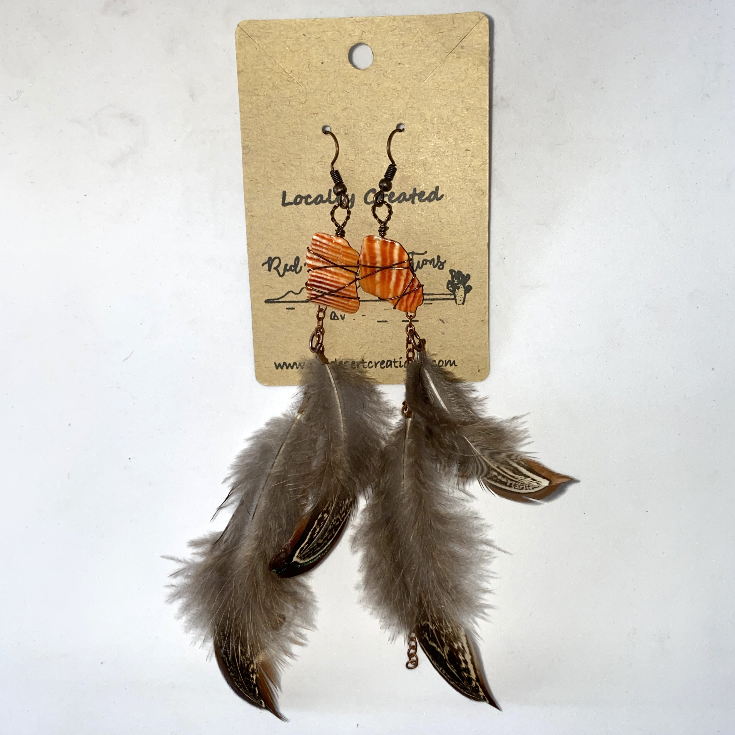 Lions Paw Shell Earrings // $58