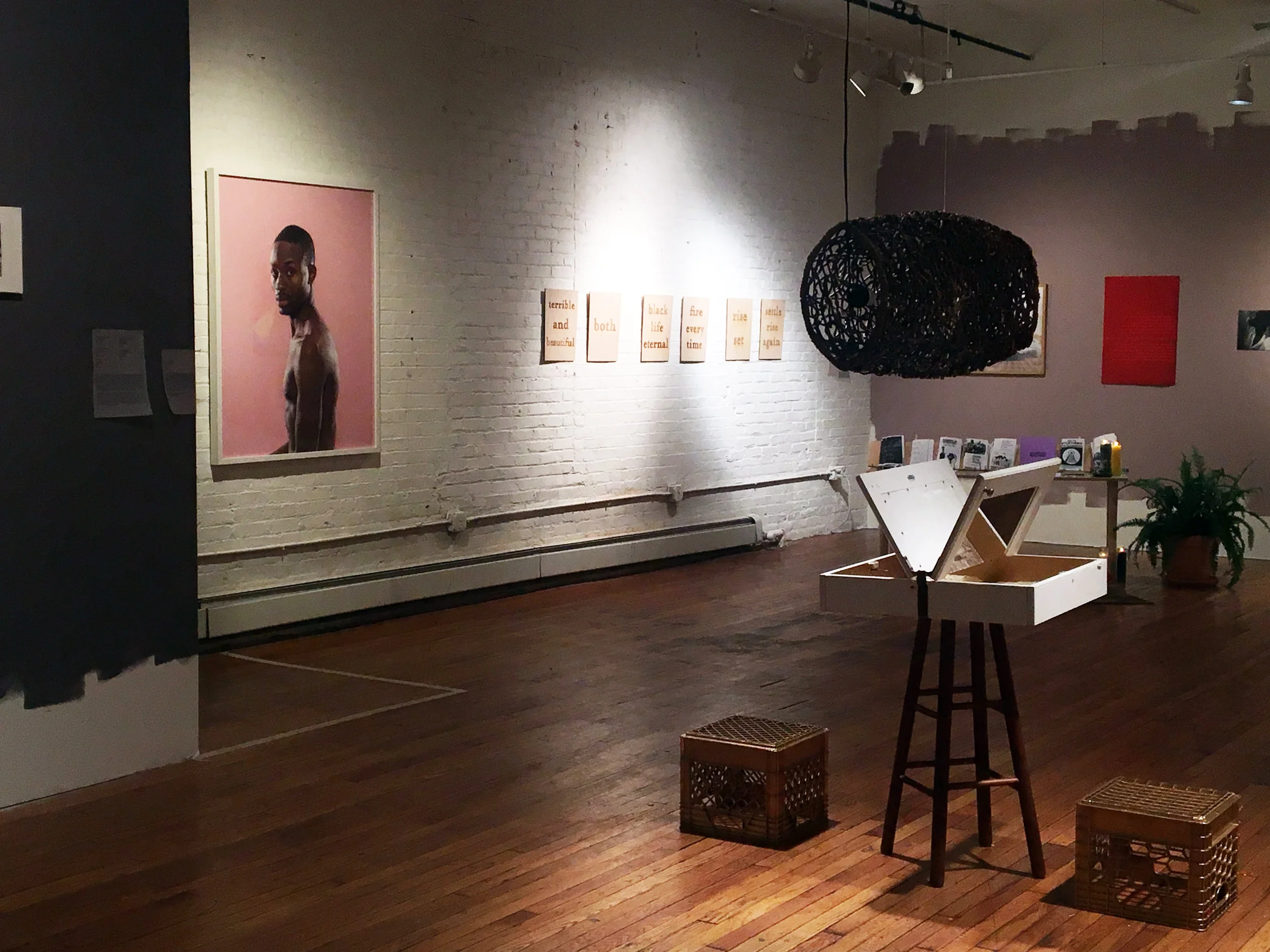  (Brick Wall, From Left to Right)     Untitled, (Shomari), 2013-2017  Jonathan Gardenhire  Archival PIgment Print  2013-2017  50x40”     Terrible and Beautiful  Shani Peters  Laser cut wood words - diptych  2016  Both 12x16”     Eternal, Every Time  