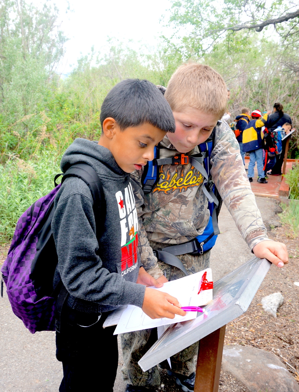5th graders explore a local nature area learning about watershed science.