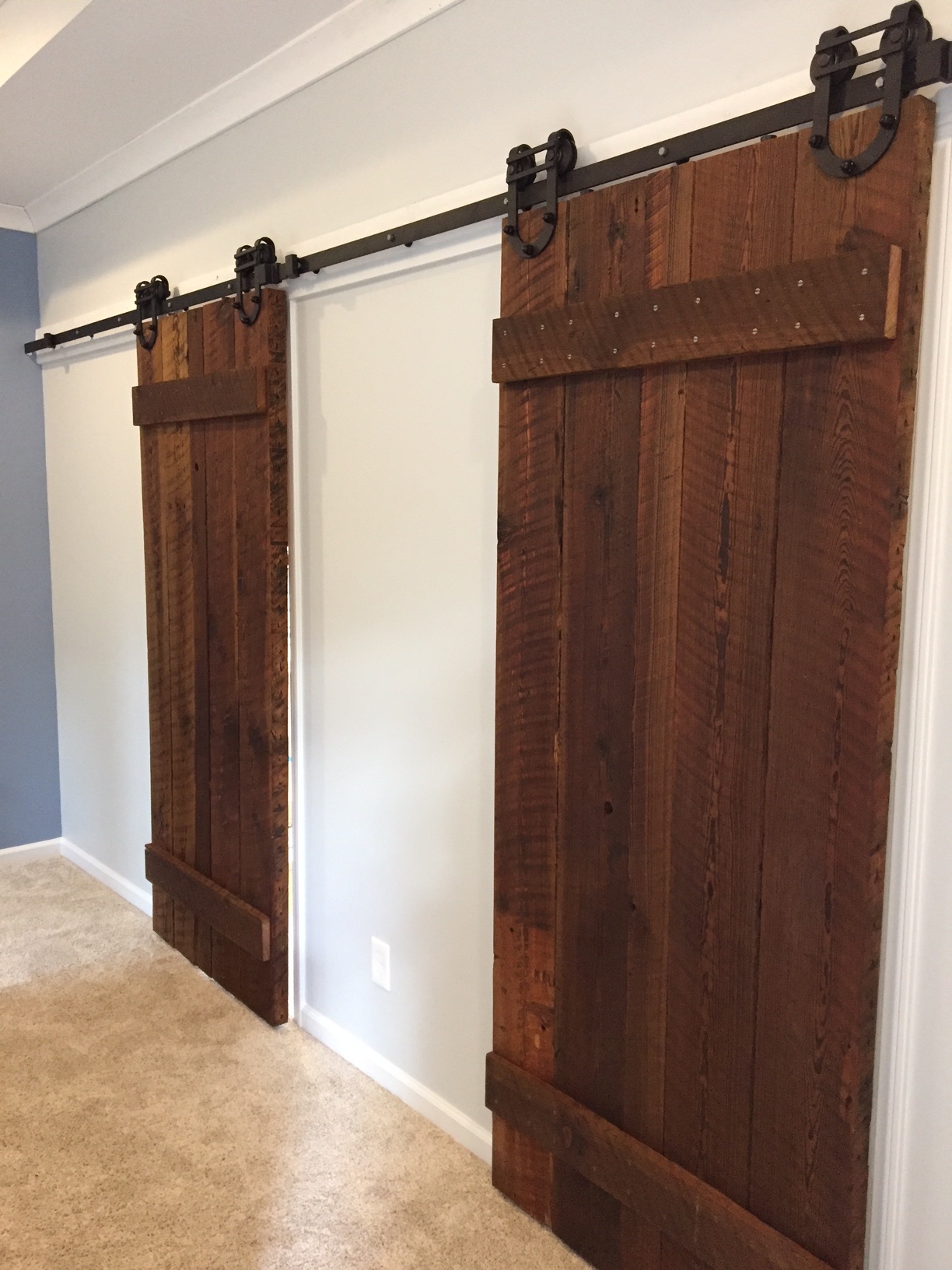Bathroom & Closet doors covered by Georgia Tech Tower repurposed lumber.